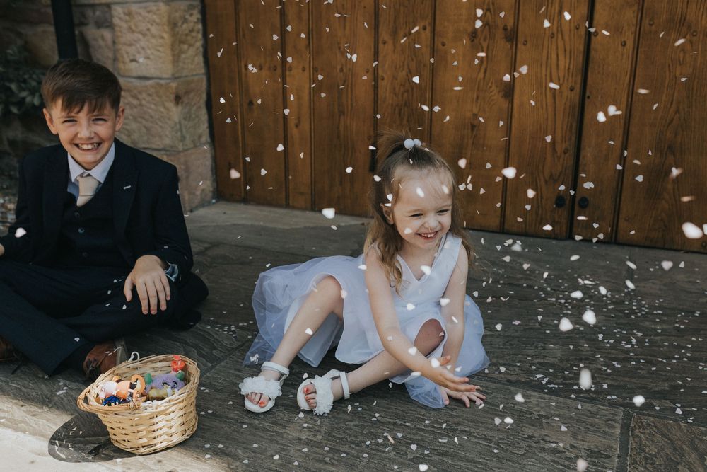 browsholme and the tithe barn wedding photography flower girl confetti