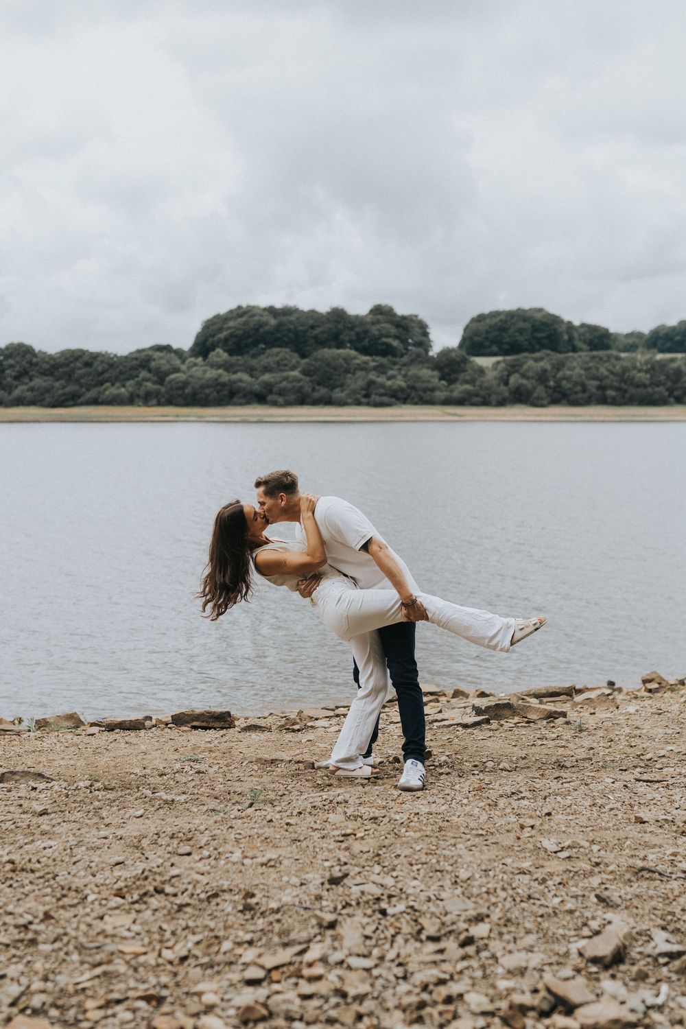 rivington pre wedding engagement photography session couple dip kiss lake