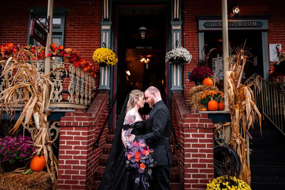 A series of fall-themed outdoor portraits with autumn decor and pumpkins against a rustic brick backdrop.