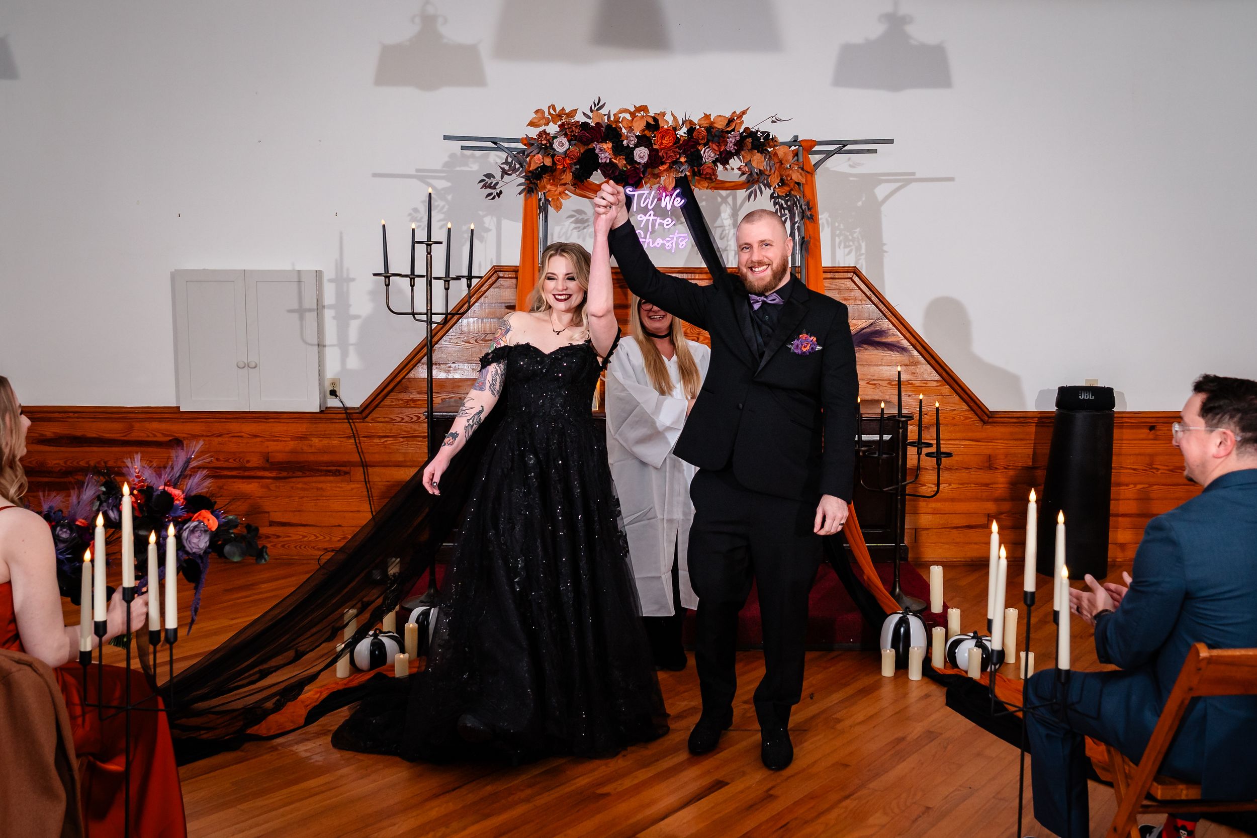 A series of romantic wedding photos showing couples dancing and embracing in a rustic indoor venue with candlelit decor.