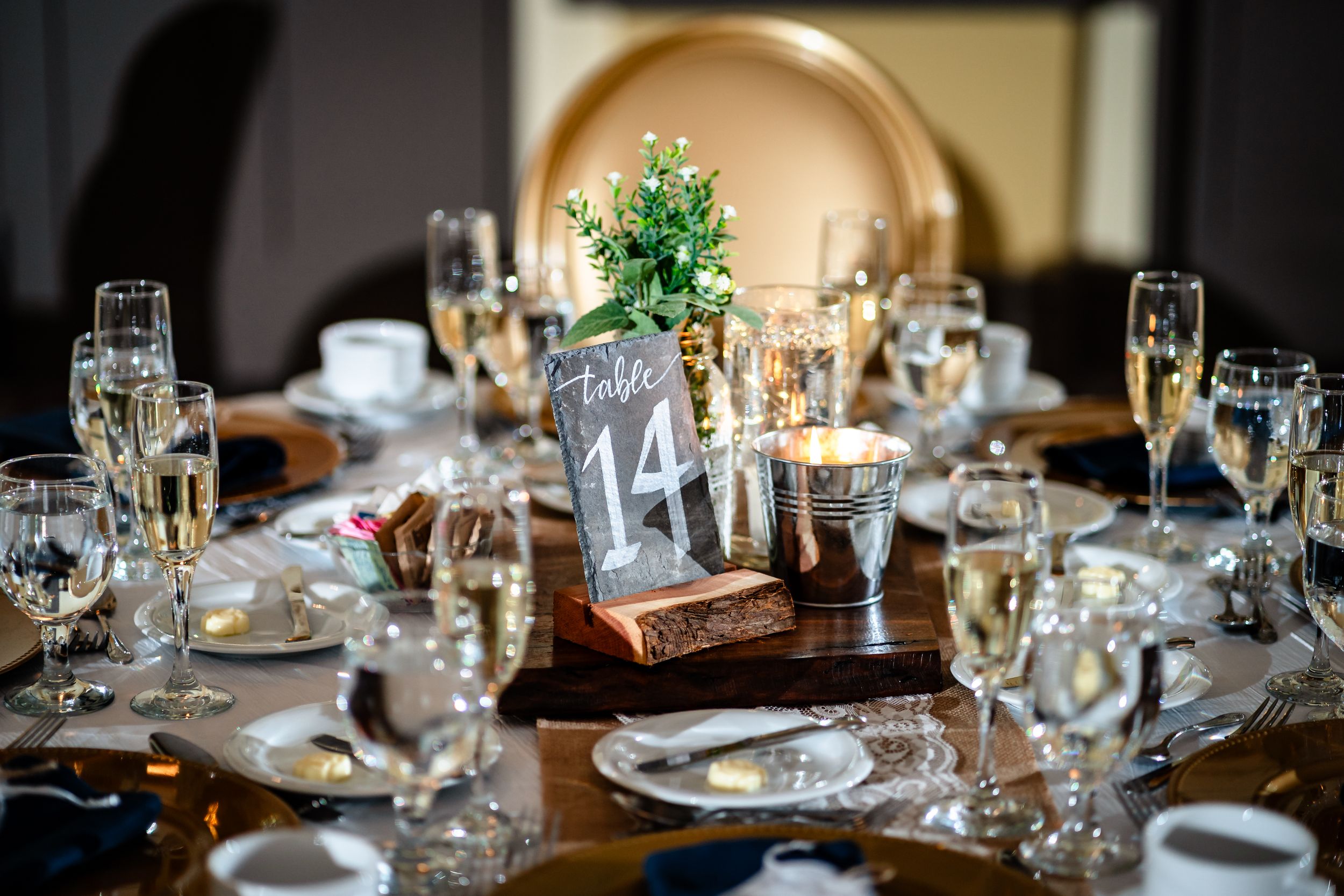Elegant table settings with wine glasses and place settings arranged for a formal dining event at a restaurant.
