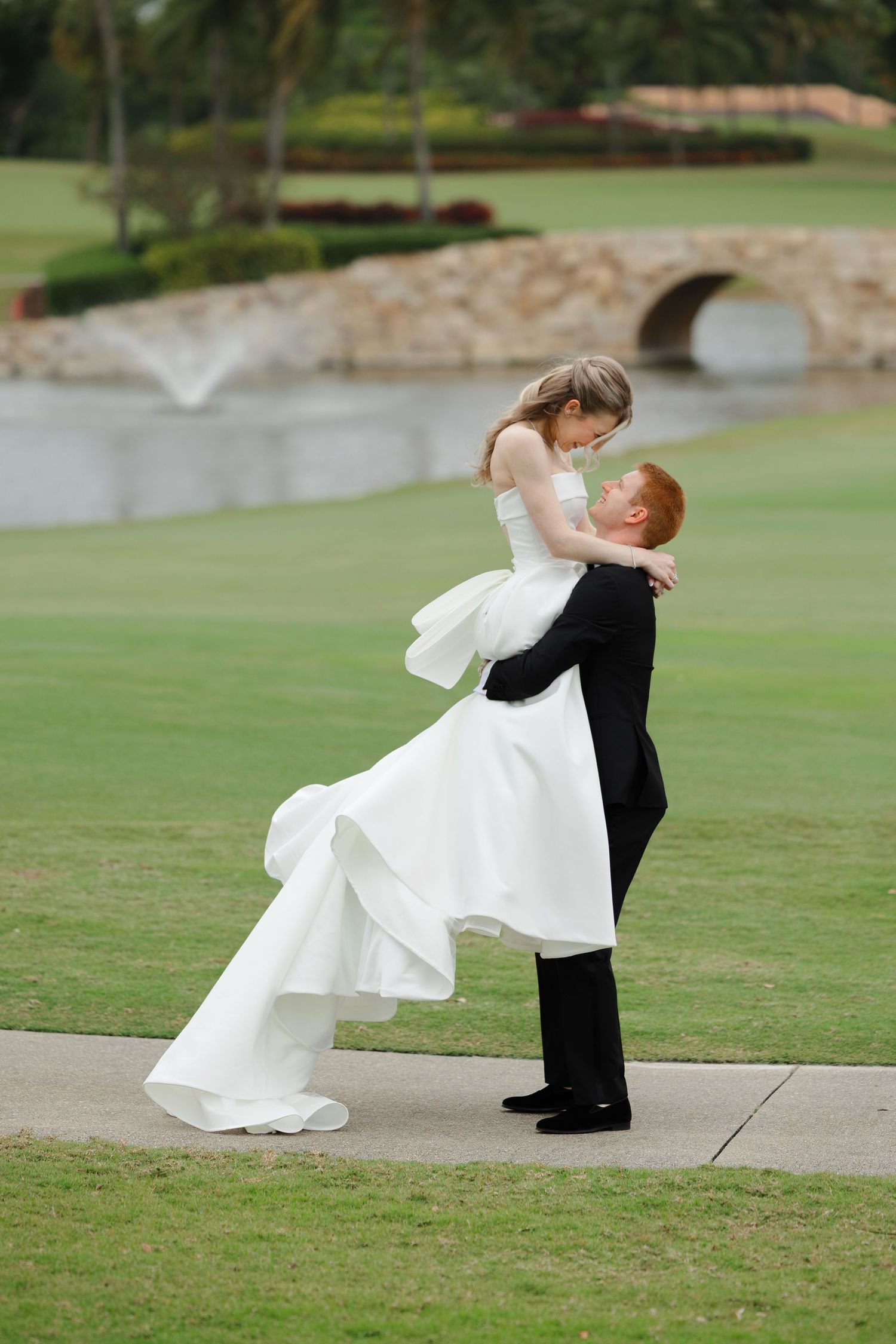Bride and groom portrait at BallenIsles Country Club in Palm Beach, Florida during a wedding photographed by Tom Forrest of Ohio.