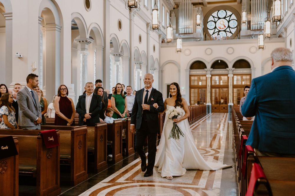 Bride walking down aisle at Sacred Heart Cathedral Knoxville, Tennessee wedding ceremony