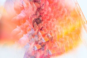 Abstract colorful gradient backdrop in warm orange and pink tones.