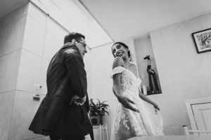 Creative wedding party preparation scene in a bright indoor space.