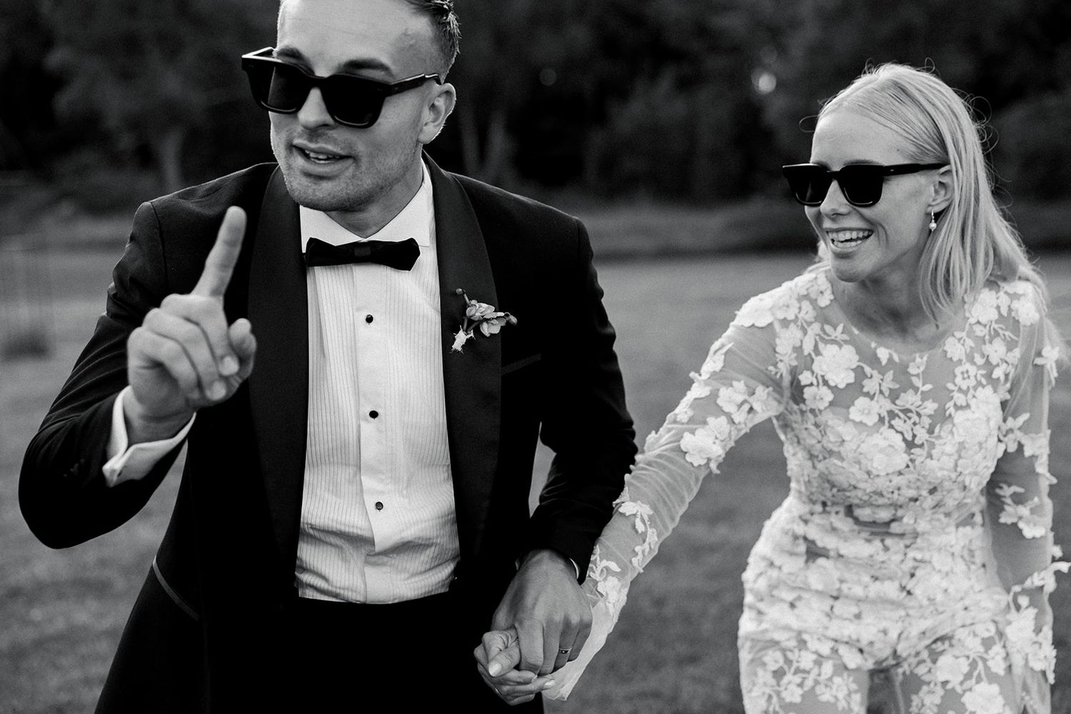 Black and white wedding photo montage showing joyful moments between a couple in formal attire.