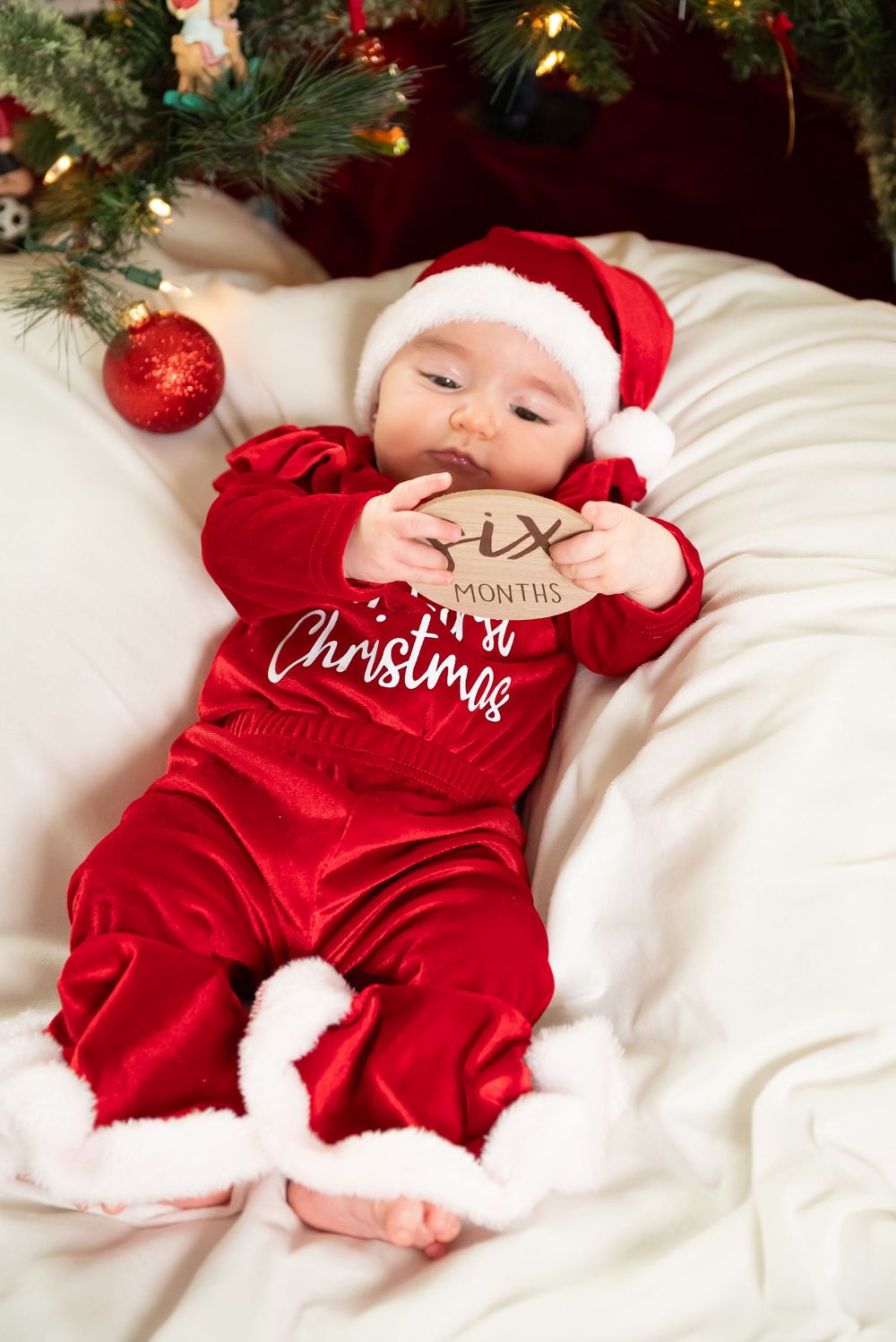 New Jersey baby photographer capturing a smiling baby in a warm studio setting