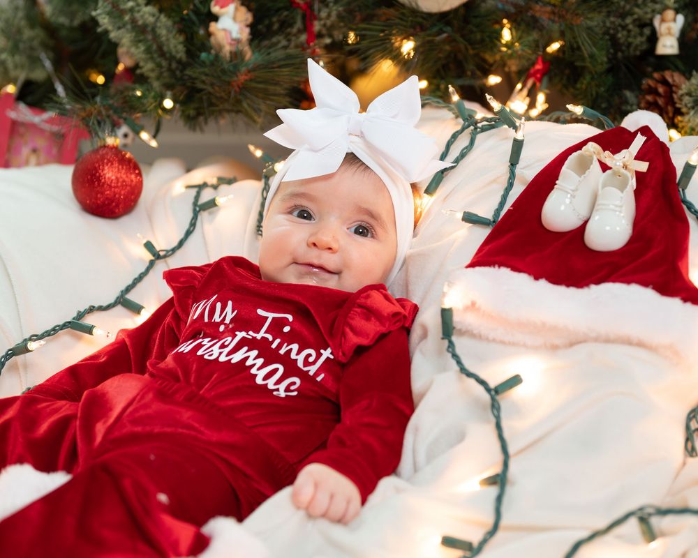 New Jersey baby photographer capturing a smiling baby in a warm studio setting