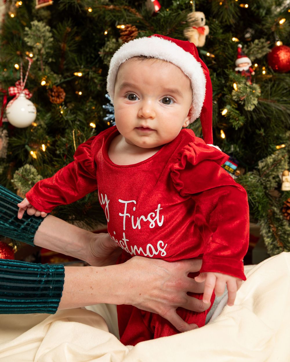 New Jersey baby photographer capturing a smiling baby in a warm studio setting