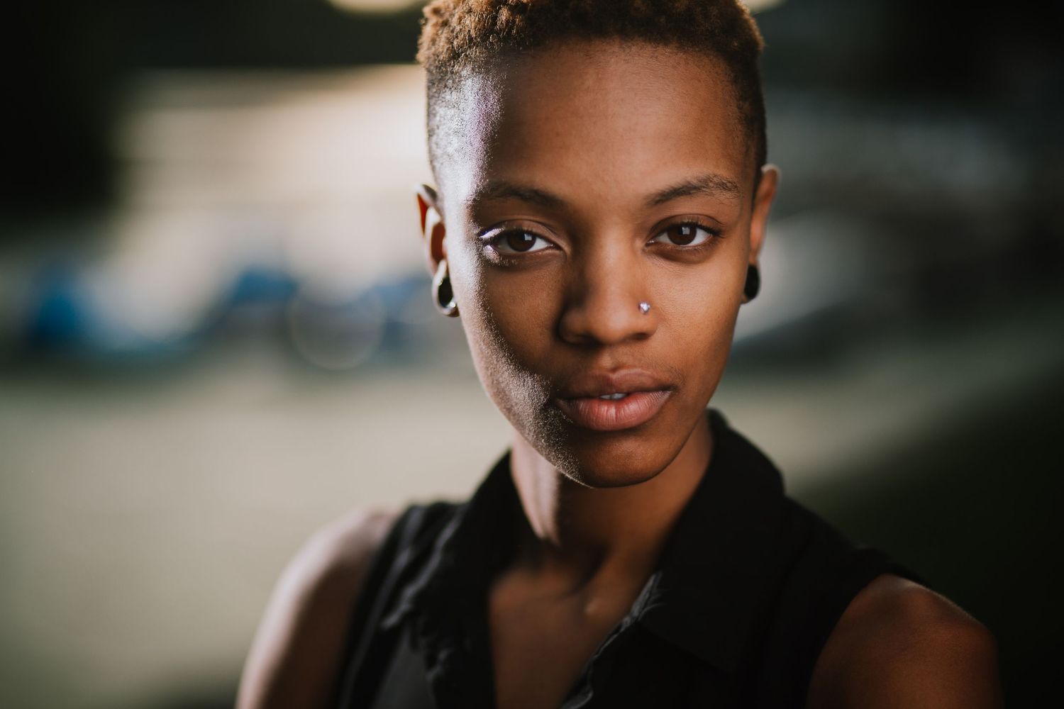 A series of portrait photographs showing different expressions and poses against dark backgrounds.