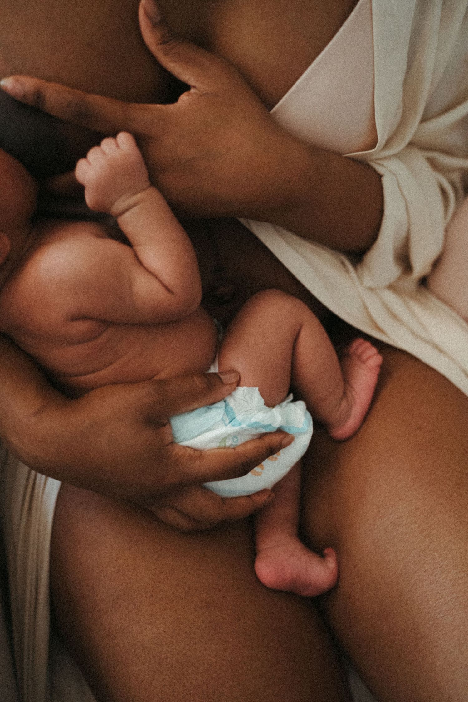 Detailed shots focusing on a nursing baby's tiny features and movements.