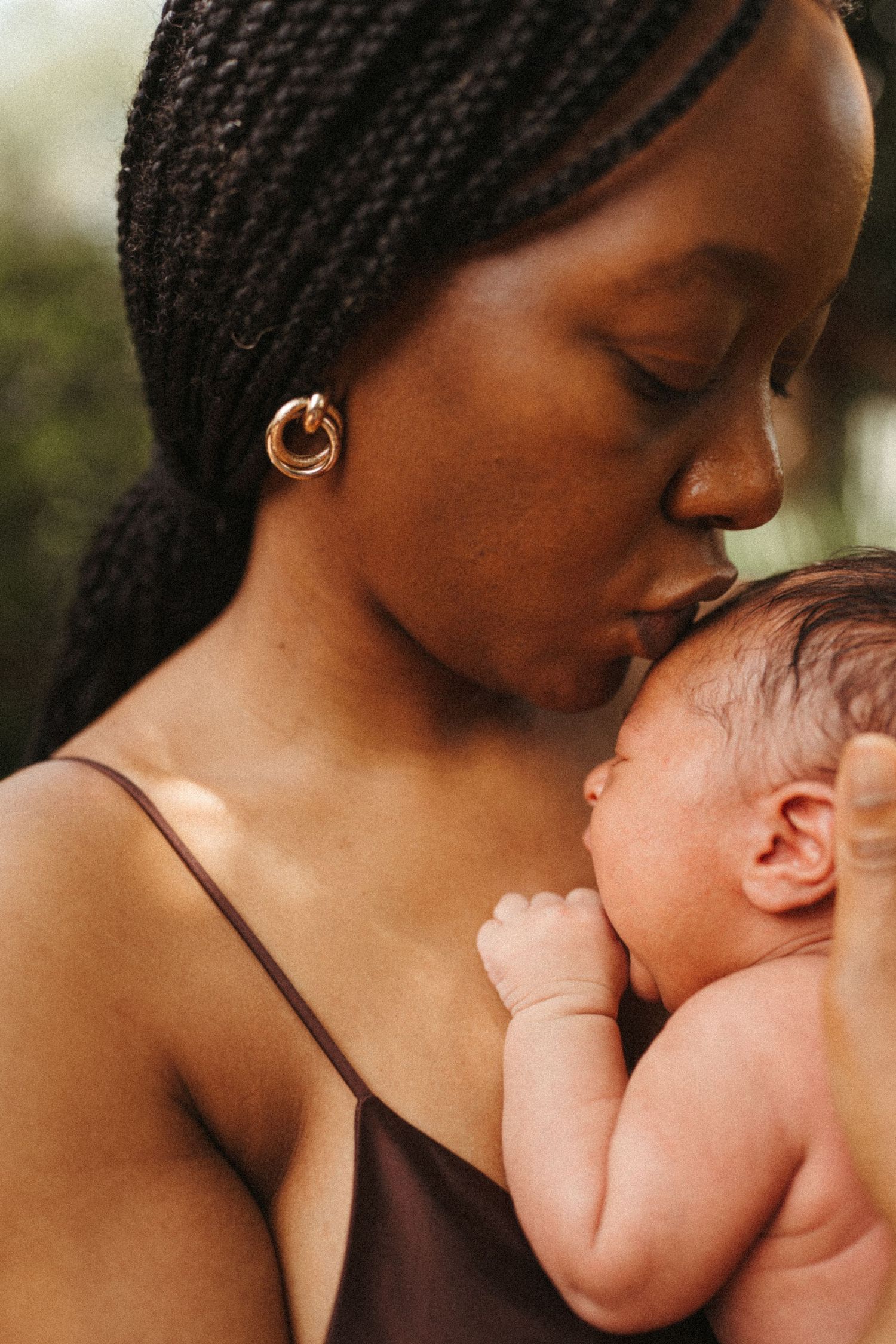 Intimate portrait series showing maternal bonding moments in warm natural light.