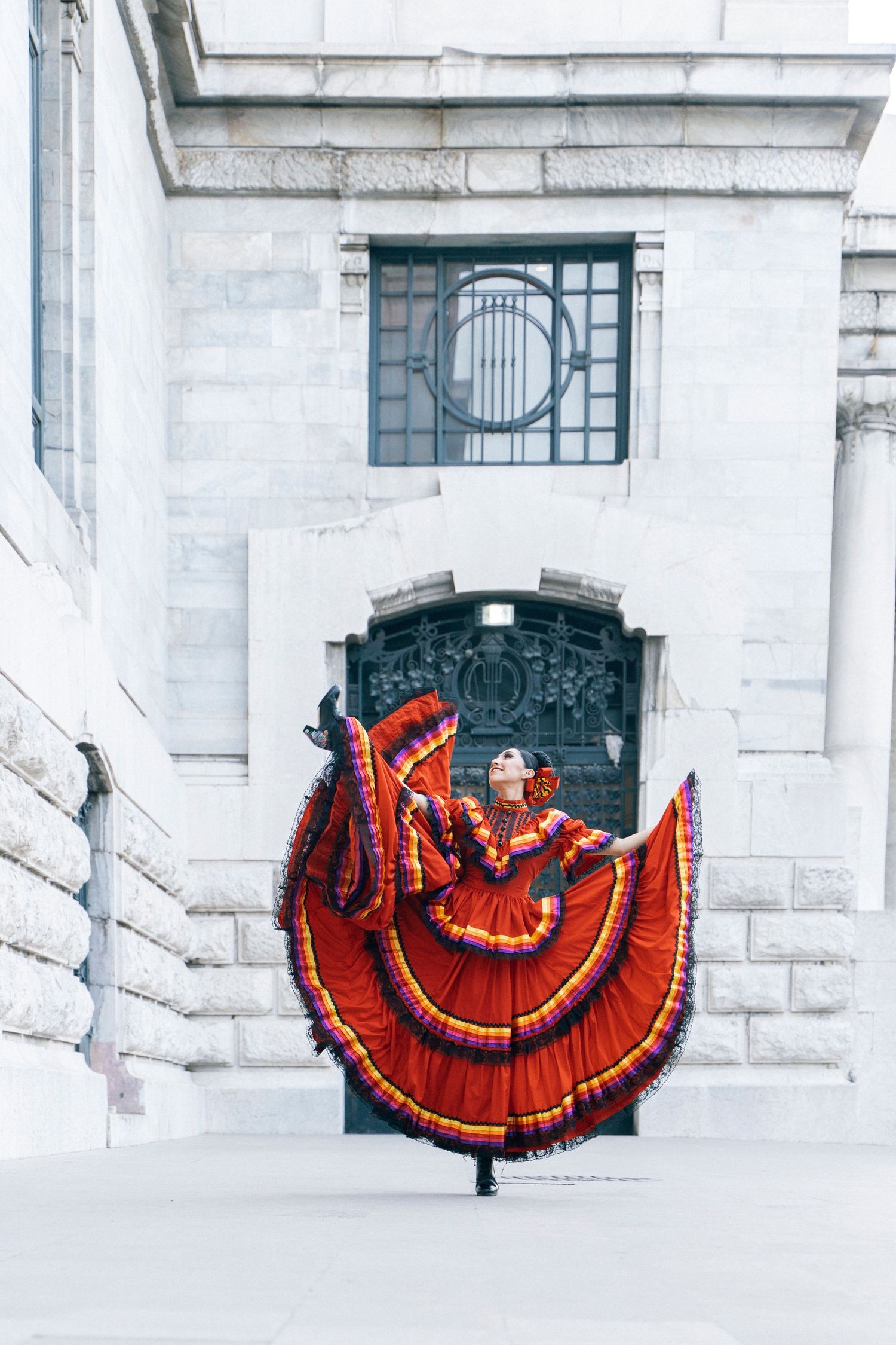 Traditional Ballet Folklórico dance photoshoot with historic Palacio de Bellas Artes backdrop