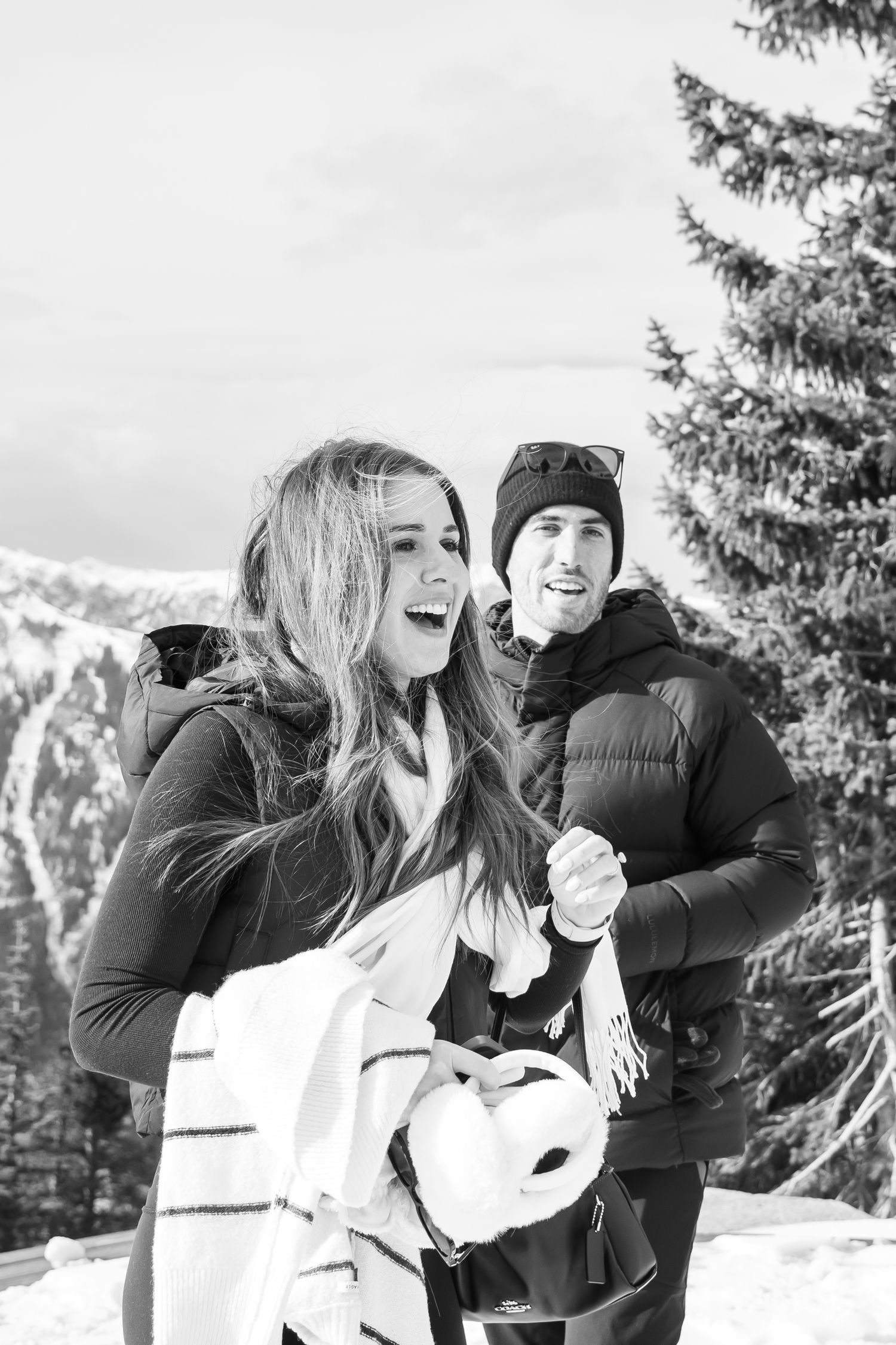 Black and white candid reaction of a stylish girl after a surprise proposal at The Aspen Wedding Deck.