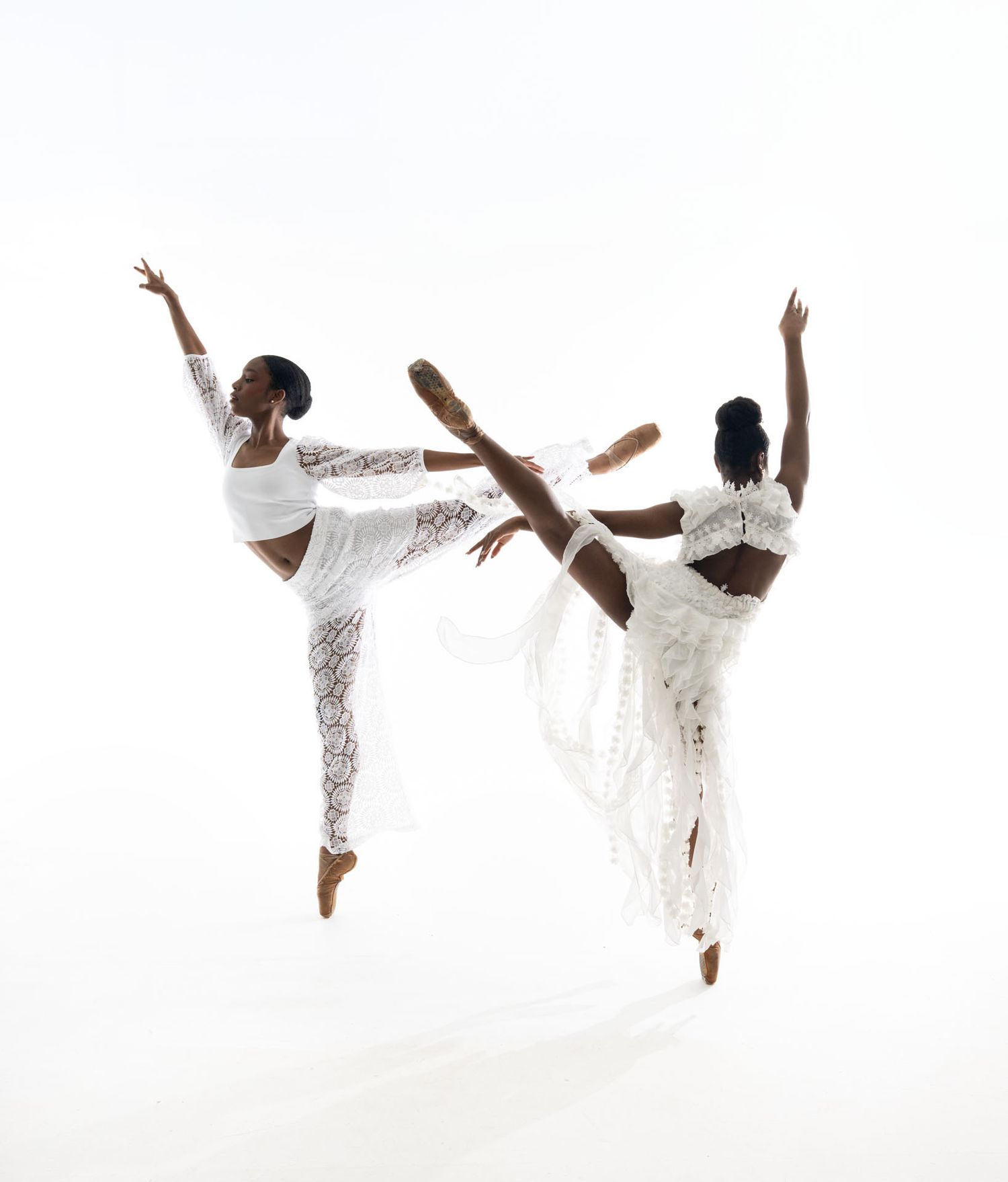 Graceful dancers in flowing white dresses perform elegant movements in a series of artistic dance poses.