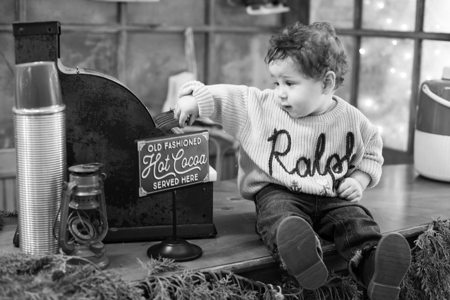 Cincinnati Christmas photography featuring a toddler holiday portrait session with warm festive decor and natural childhood Christmas moment