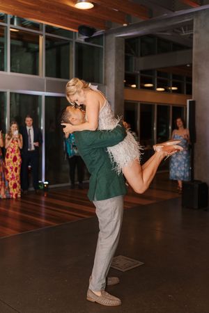 A sequence of dance moves shows two people in formal attire performing a fun dip on a dark wooden dance floor.