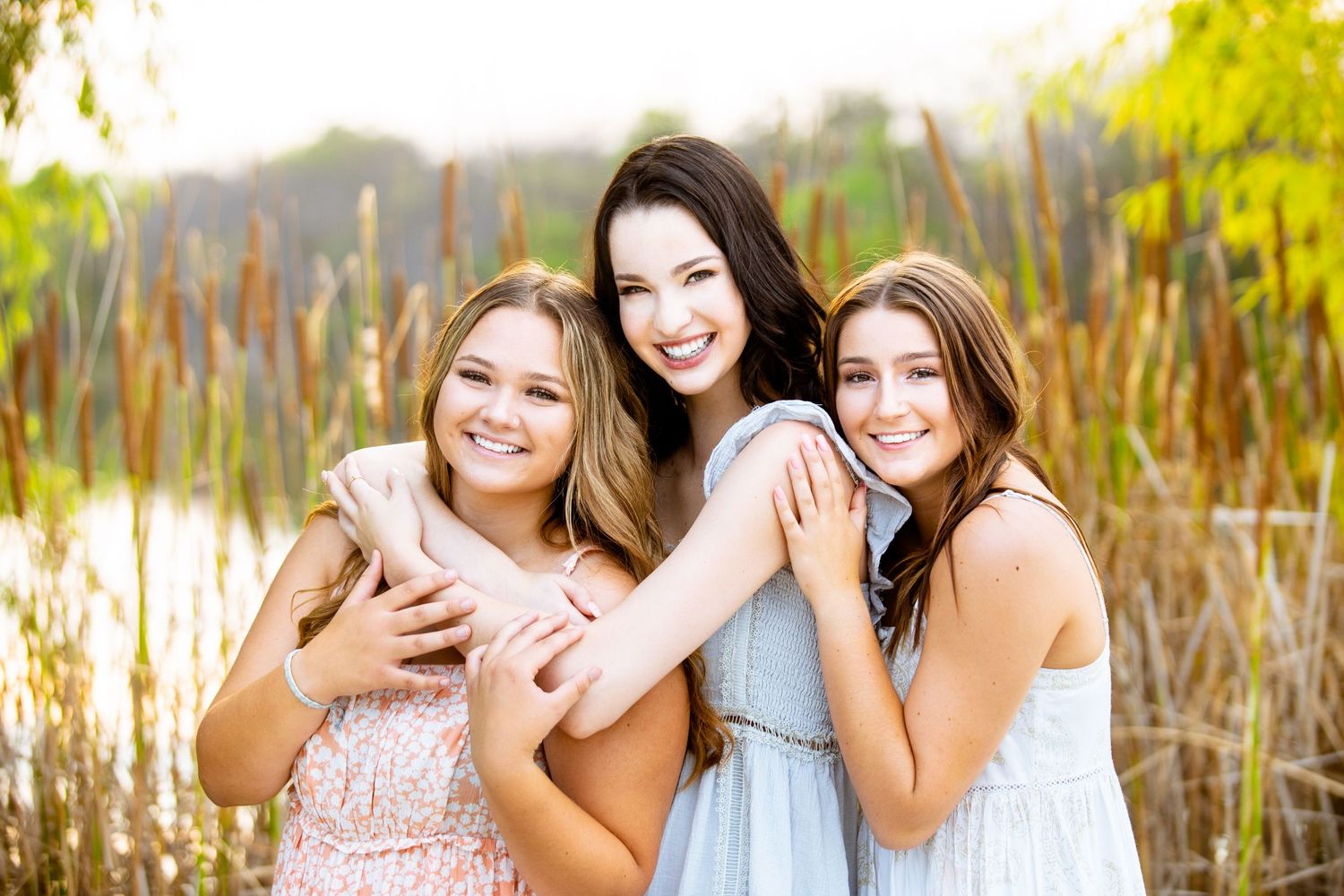 Portrait of three high school senior friends taken at sunset at Fischer Park in New Braunfels, Texas.