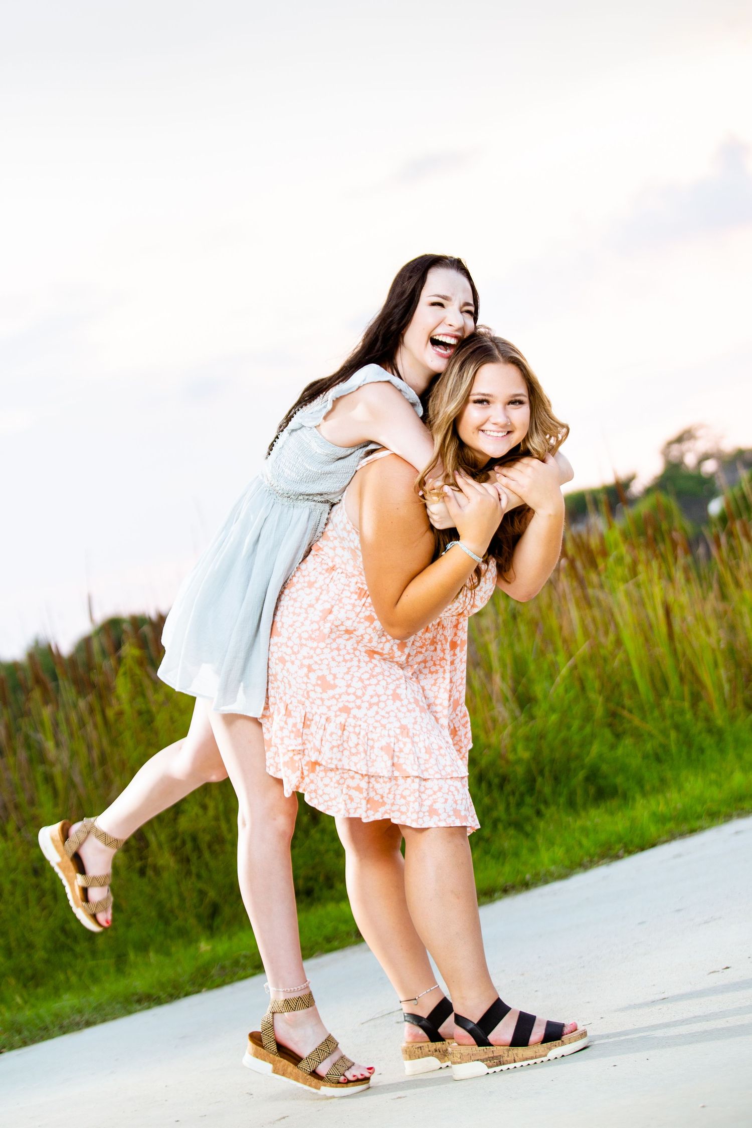 A portrait of two playful best friends taken at sunset at Fischer Park in New Braunfels, Texas.