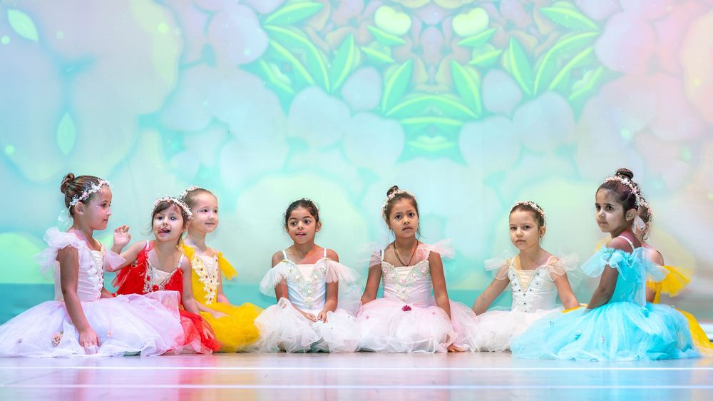 Kids ballet photoshoot in Dubai featuring soft lighting and elegant dance poses
