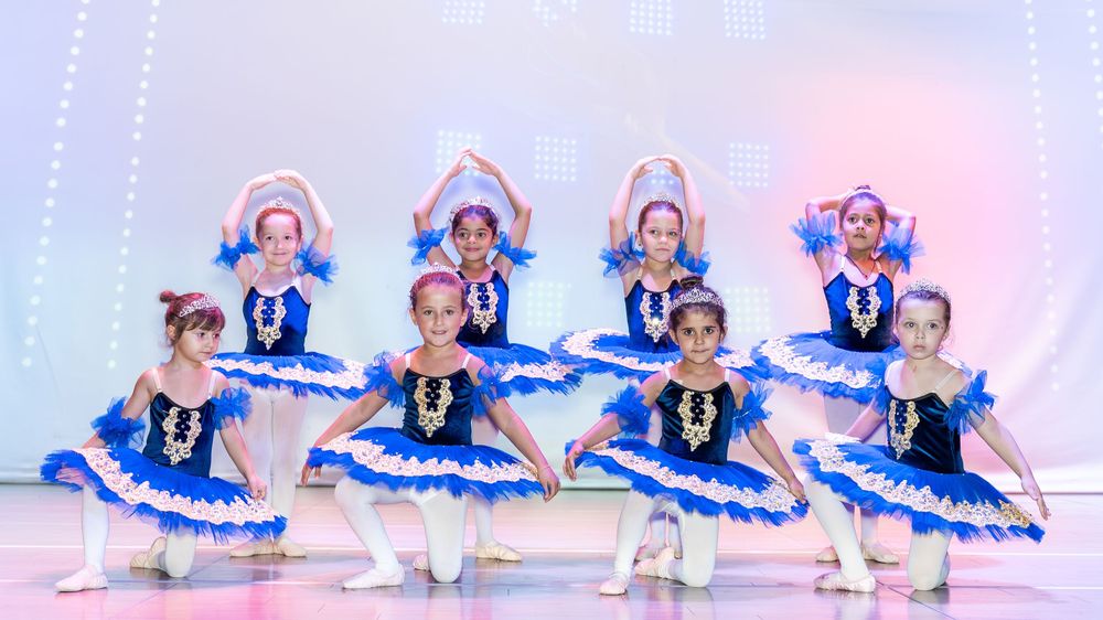 Children’s ballet class photography session with natural expressions and pastel tutus
