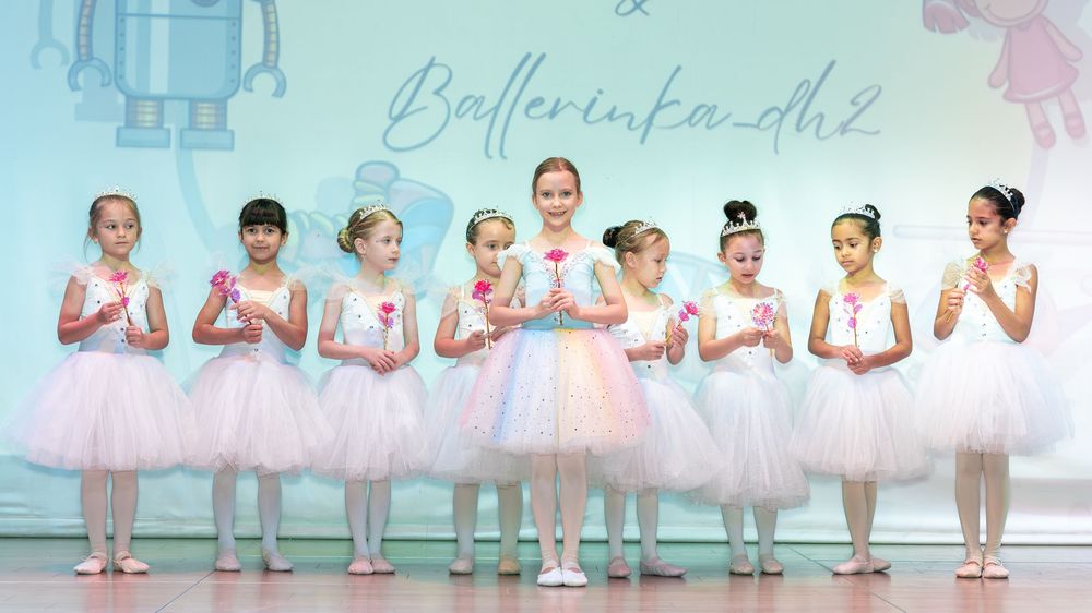 Ballet kids school photoshoot in Dubai featuring young ballerinas in white tutus posing gracefully