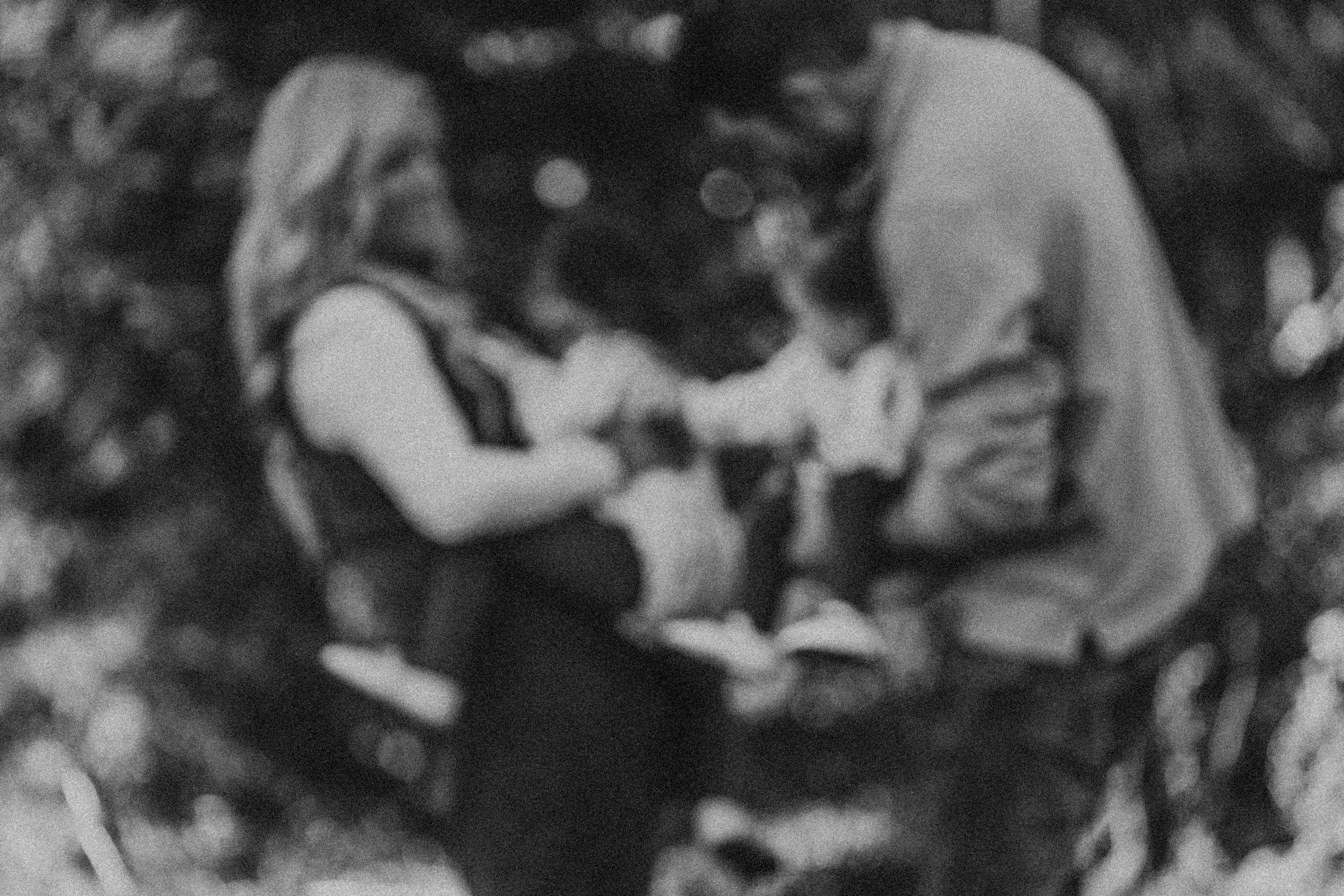 Monochromatic photo strip capturing intimate outdoor moments on a wooden bench.