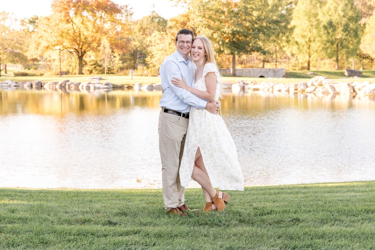 A romantic outdoor couples photoshoot showing tender embraces and laughter among pine trees in warm sunlight.