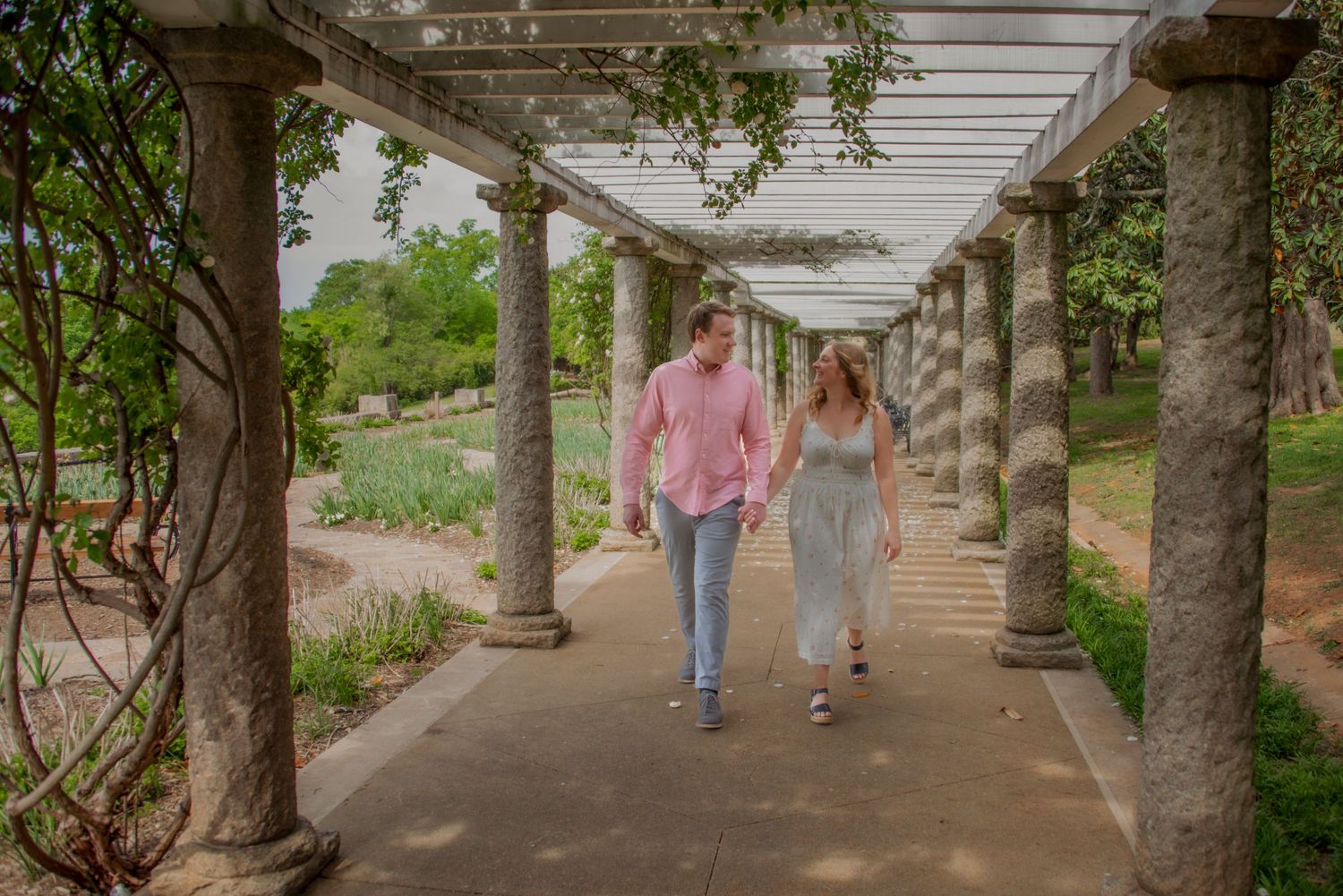 Couple holding hands and walking at Maymont Park, Italian Gardens