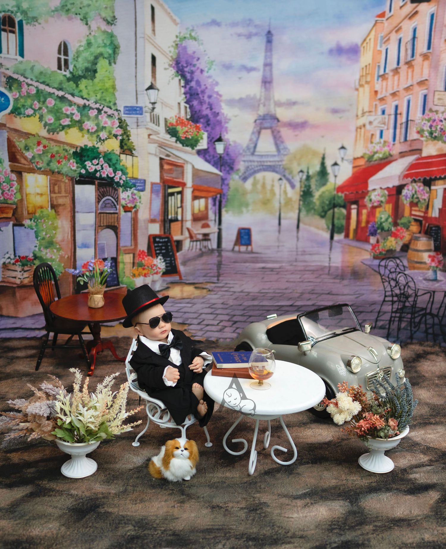 A stylish Chanel storefront decorated with pink roses and luxury shopping bags displayed outside on a table setting.
