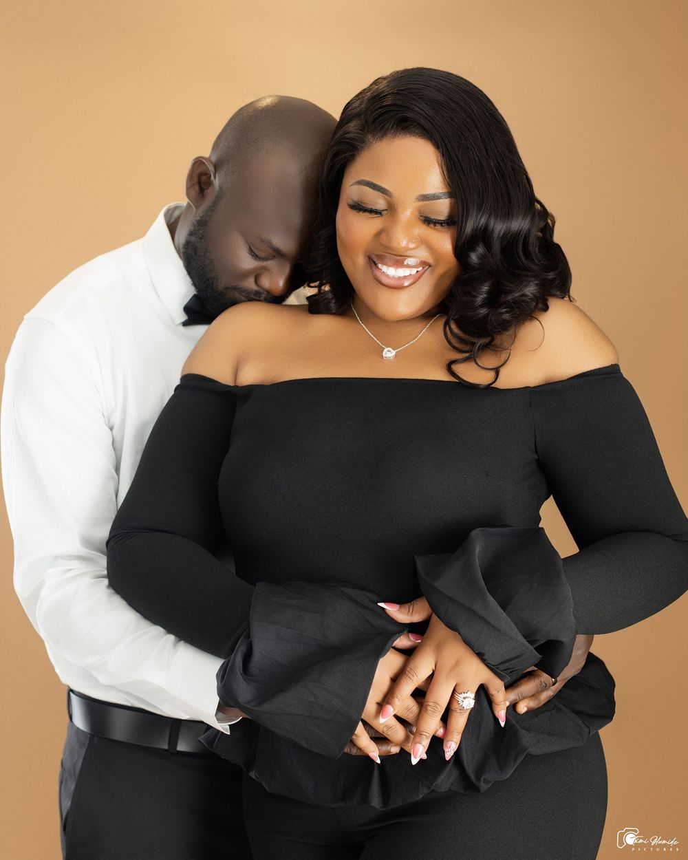 A couple in a romantic embrace wearing black and white outfits against a beige background in a photo collage.