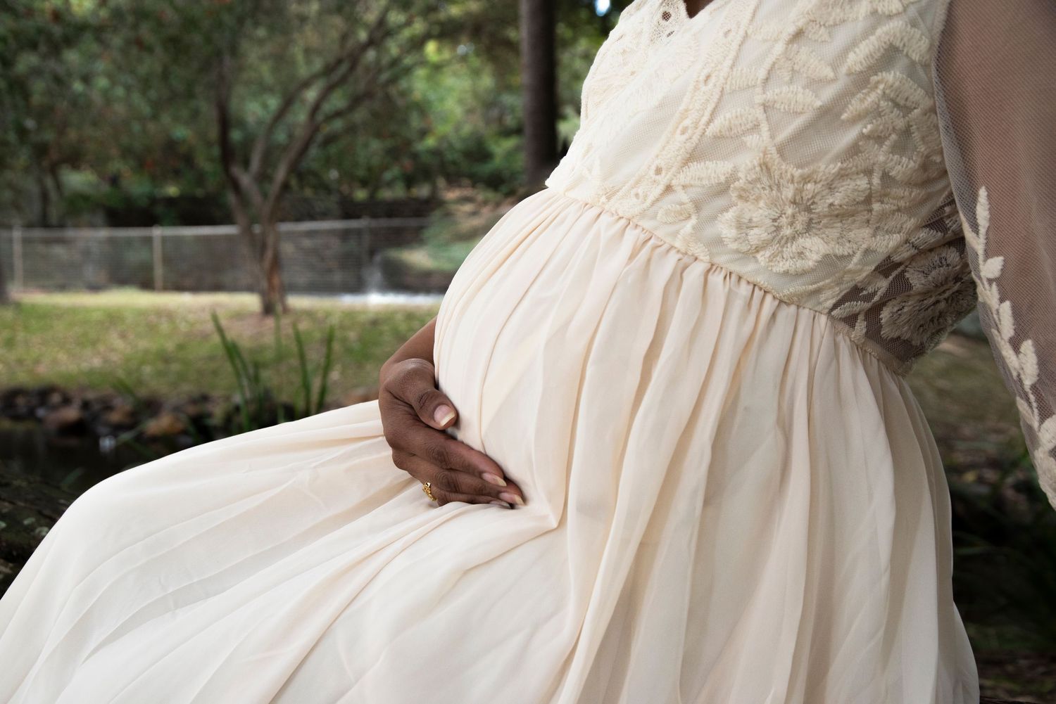 Outdoor maternity session Gold Coast beach with flowing white silk dress