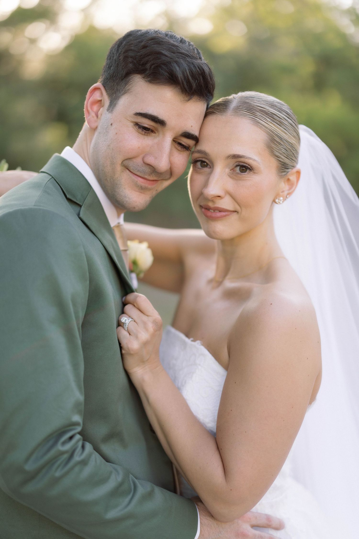 A romantic series of close-up shots showing a bride and groom in an intimate moment with a green suited groom and white veil.