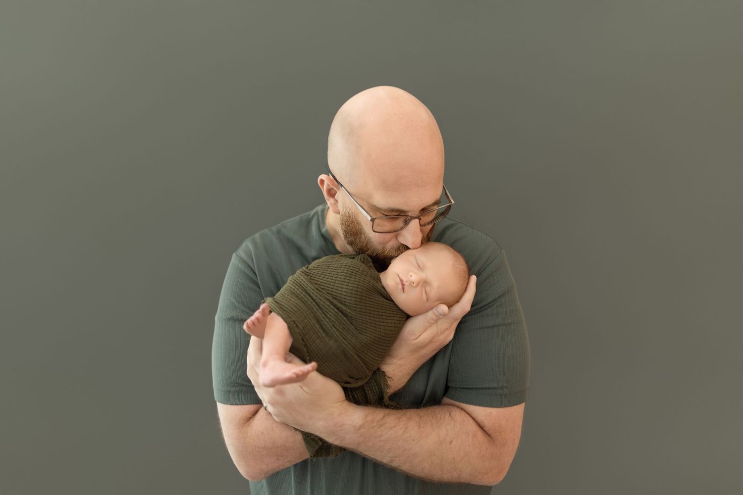 Parents share tender moments with their baby during a professional photo session. Photos by Tampa Photographer DigitalMyst Photography