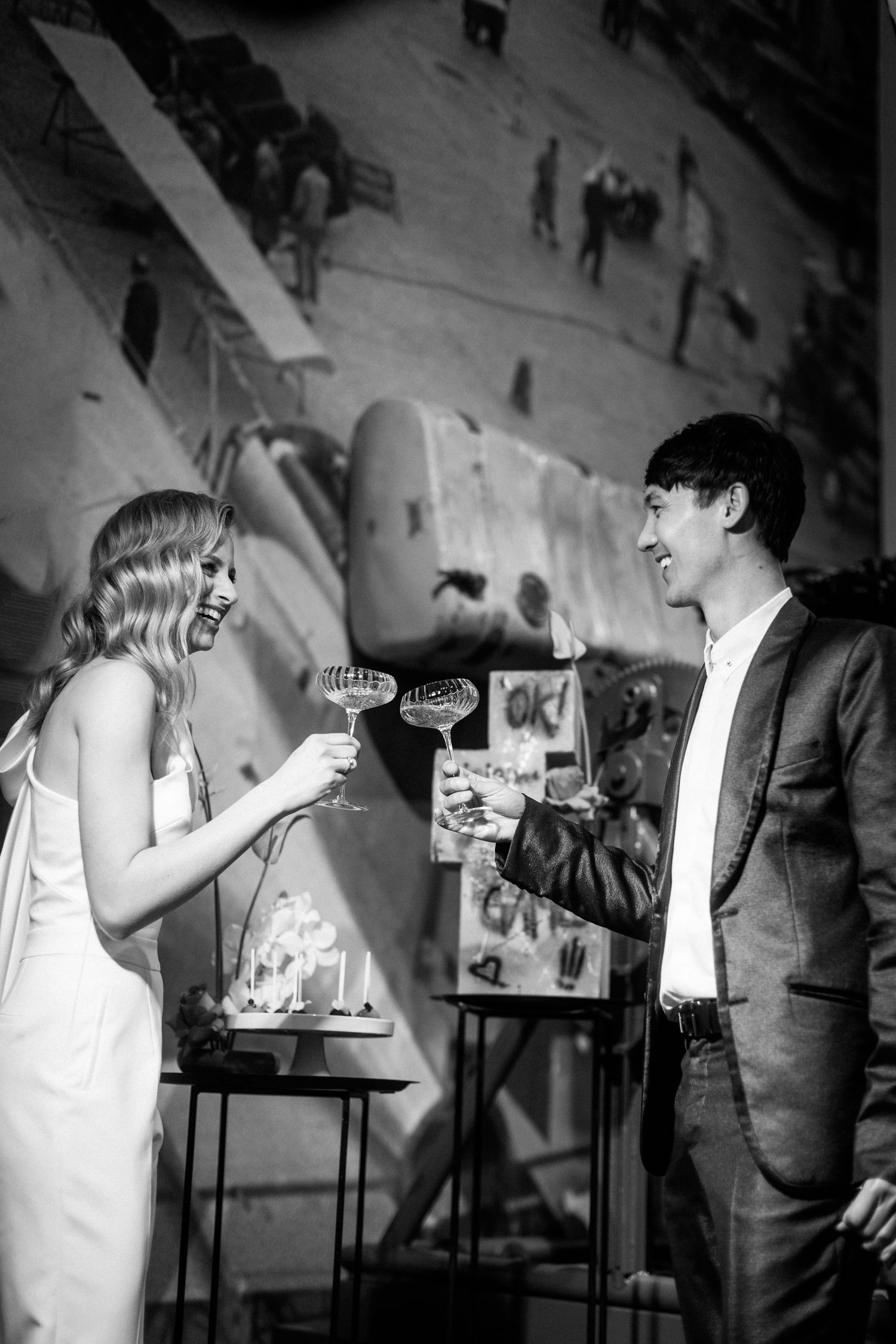 Black and white photograph showing vintage presentation scenes with people gesturing and interacting.