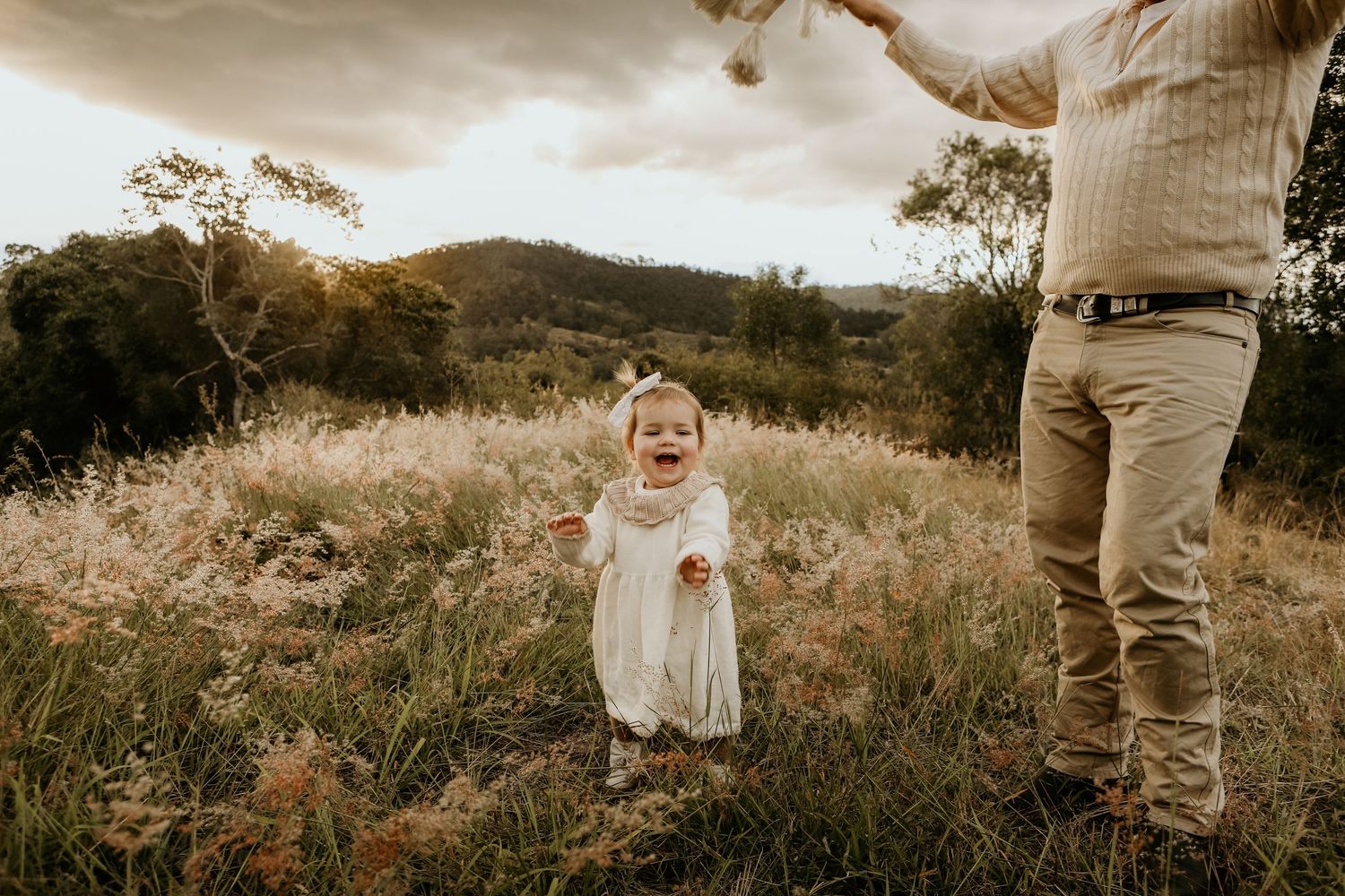 Little girl with big smiles during a outdoor game during a photoshoot