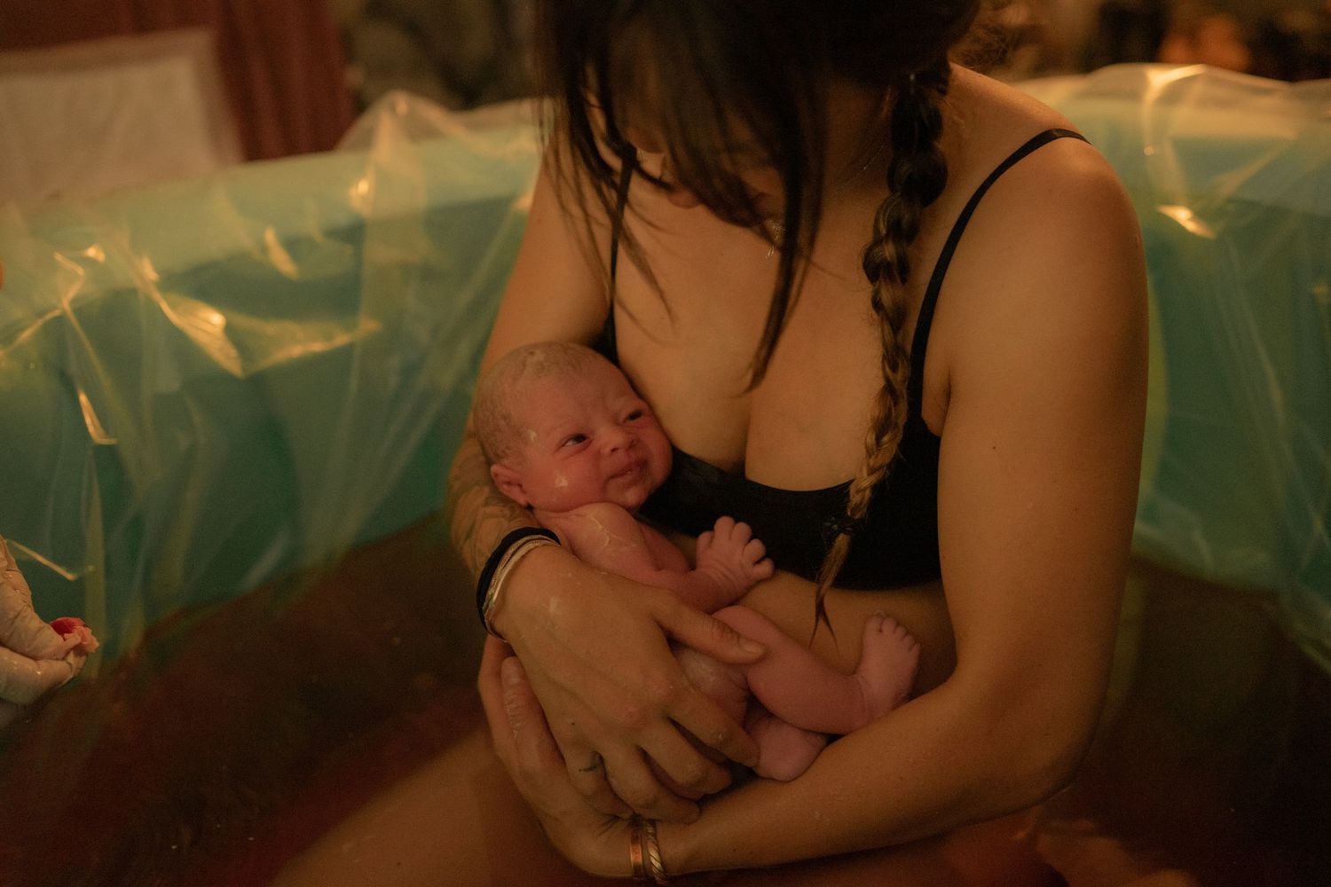 Home Birth photography, mother holding baby,  
Northern Colorado birth photographer, home birth photographer, free birth photographer
