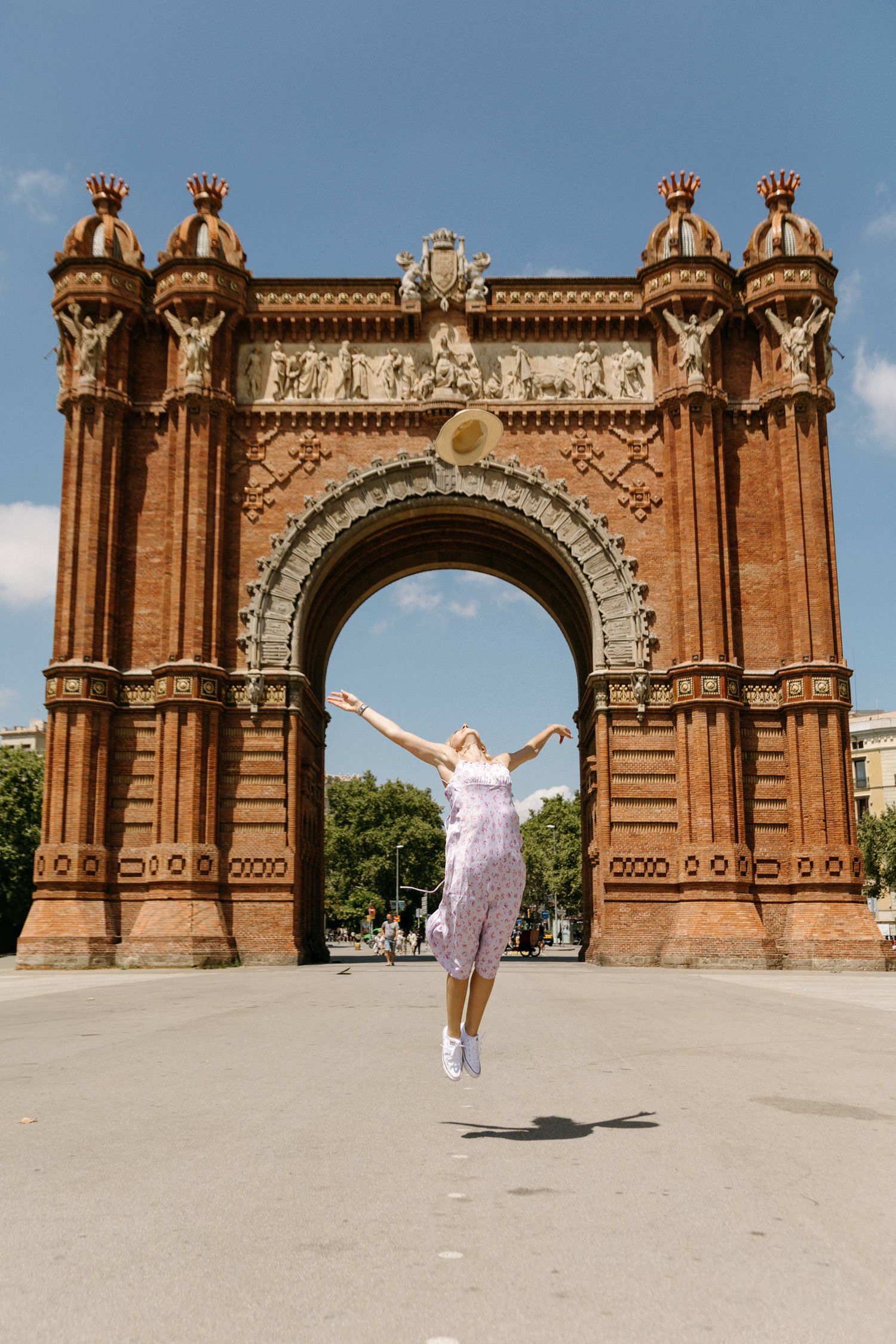 Jumping shots against the majestic backdrop of Barcelona's Arc de Triomf.