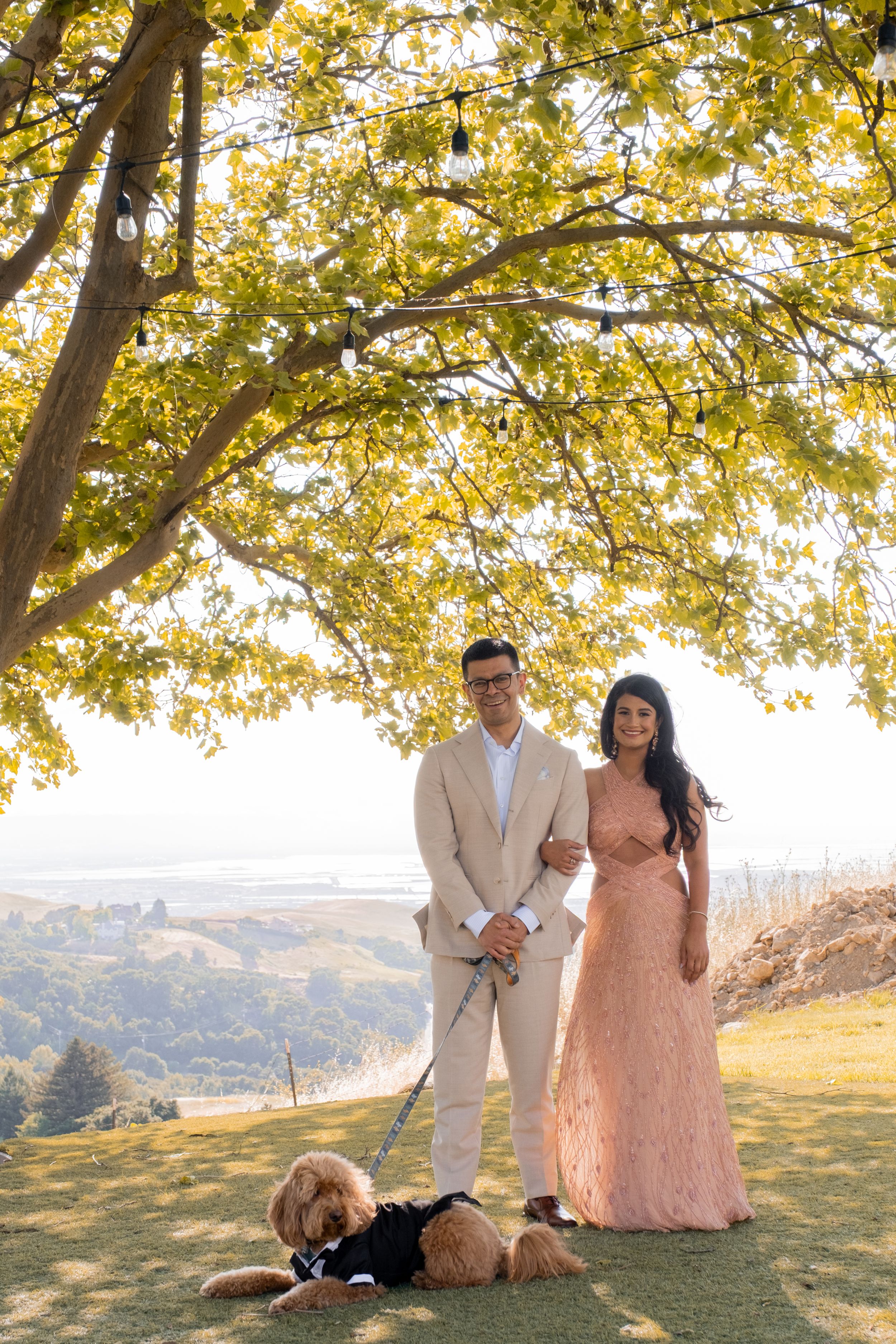 engaged couple with their dog.