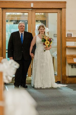 Father walking bride down the aisle
