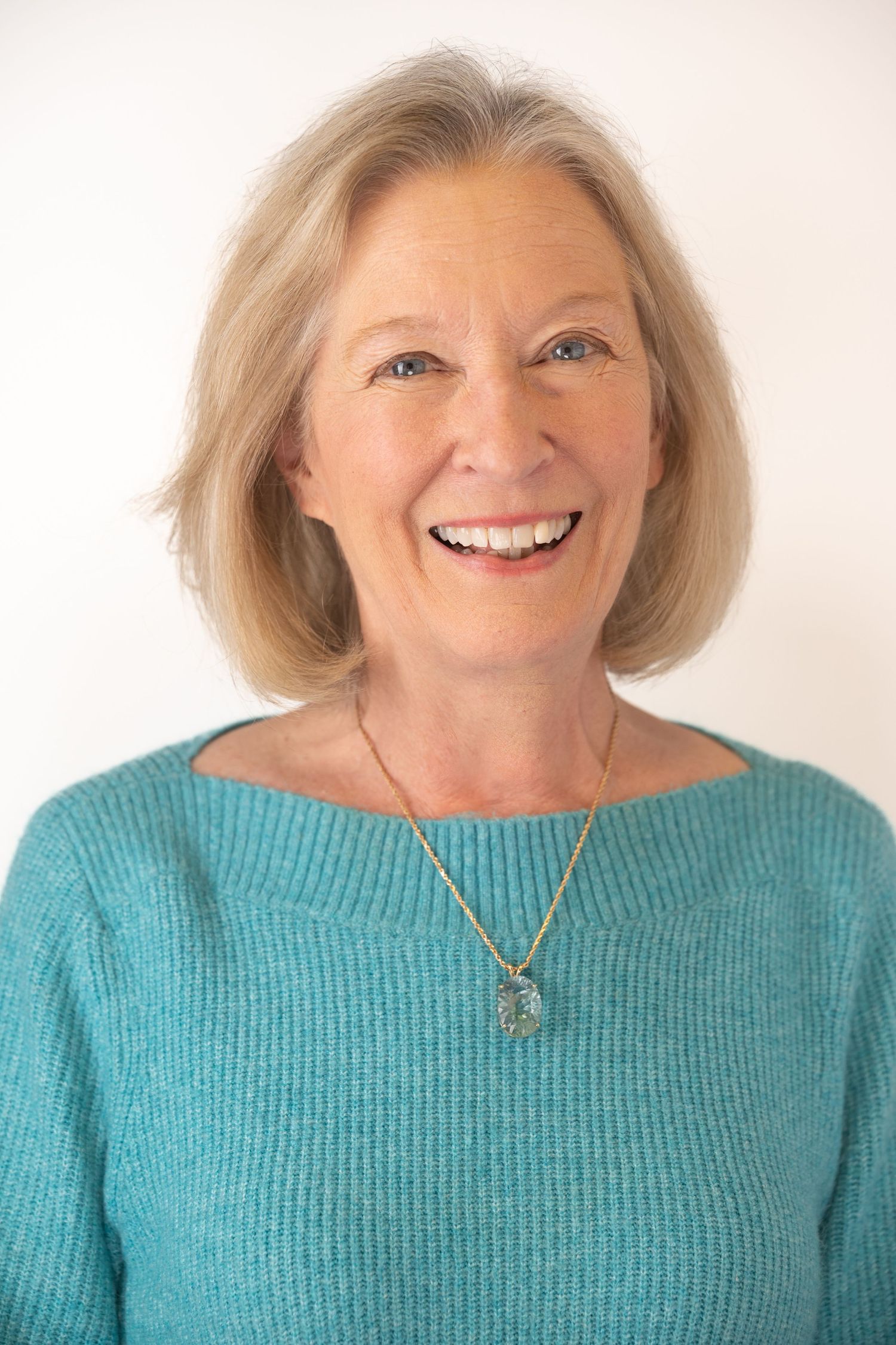 A series of five photos showing someone in a turquoise sweater expressing different emotions and expressions.