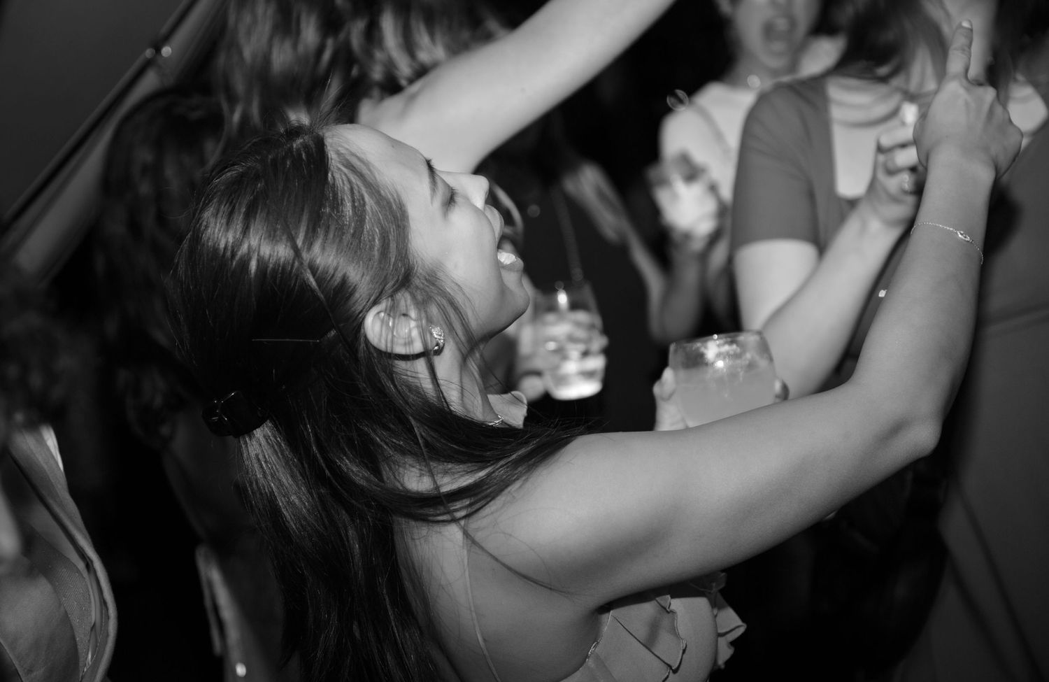 fun dancing guests enjoying celebrations black and white luxury photography