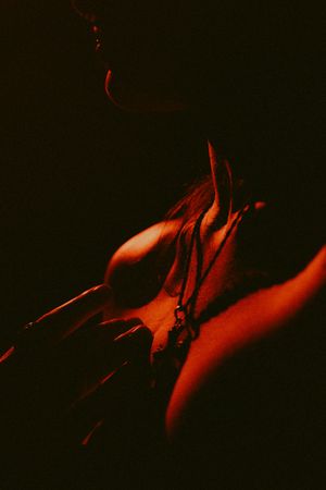 Abstract red and black art photography series showing motion blur and dark shadows in dramatic lighting.