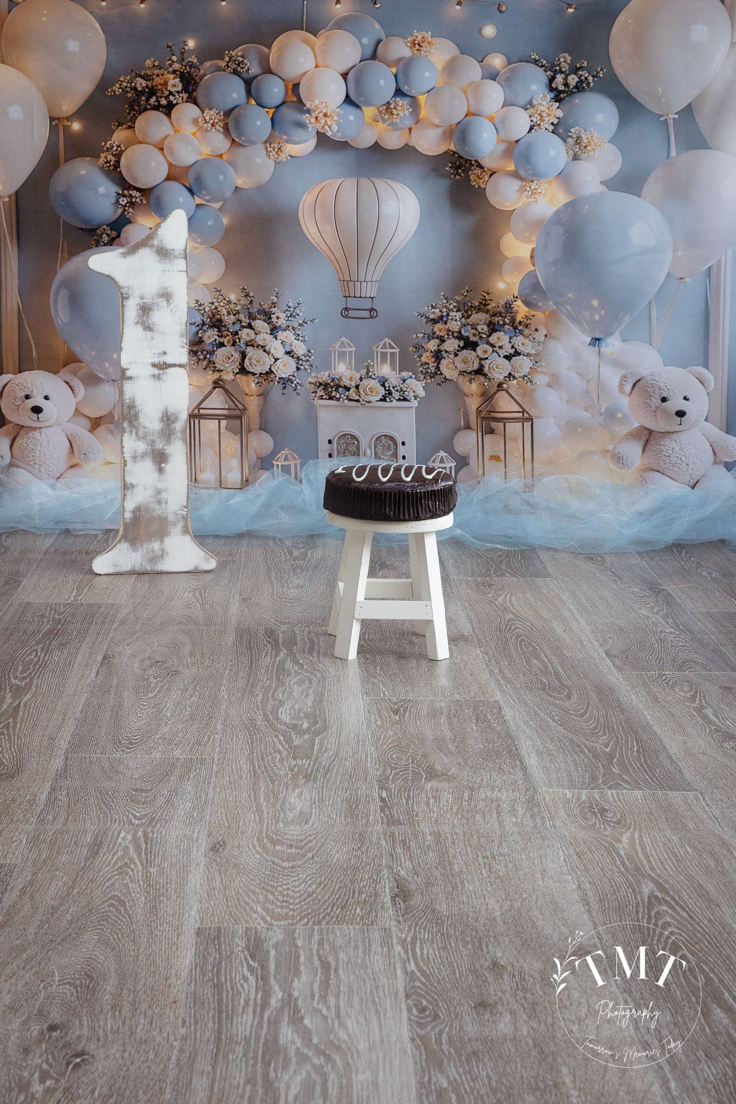 Dreamy balloon in the clouds set for a professional cake smash photo shoot