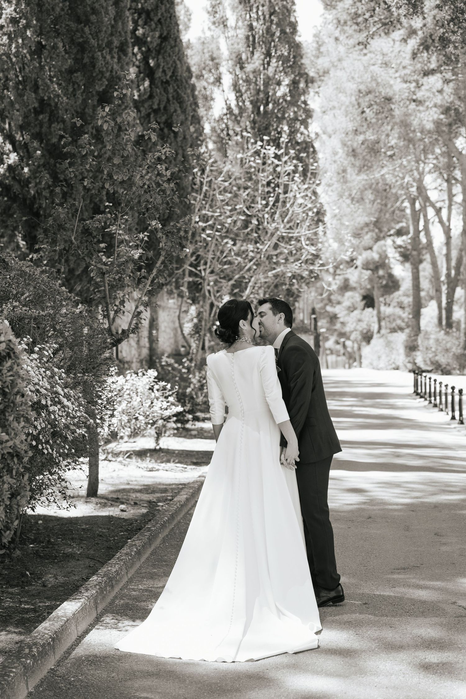 A black and white wedding photo montage showing couples dancing and celebrating at a reception.