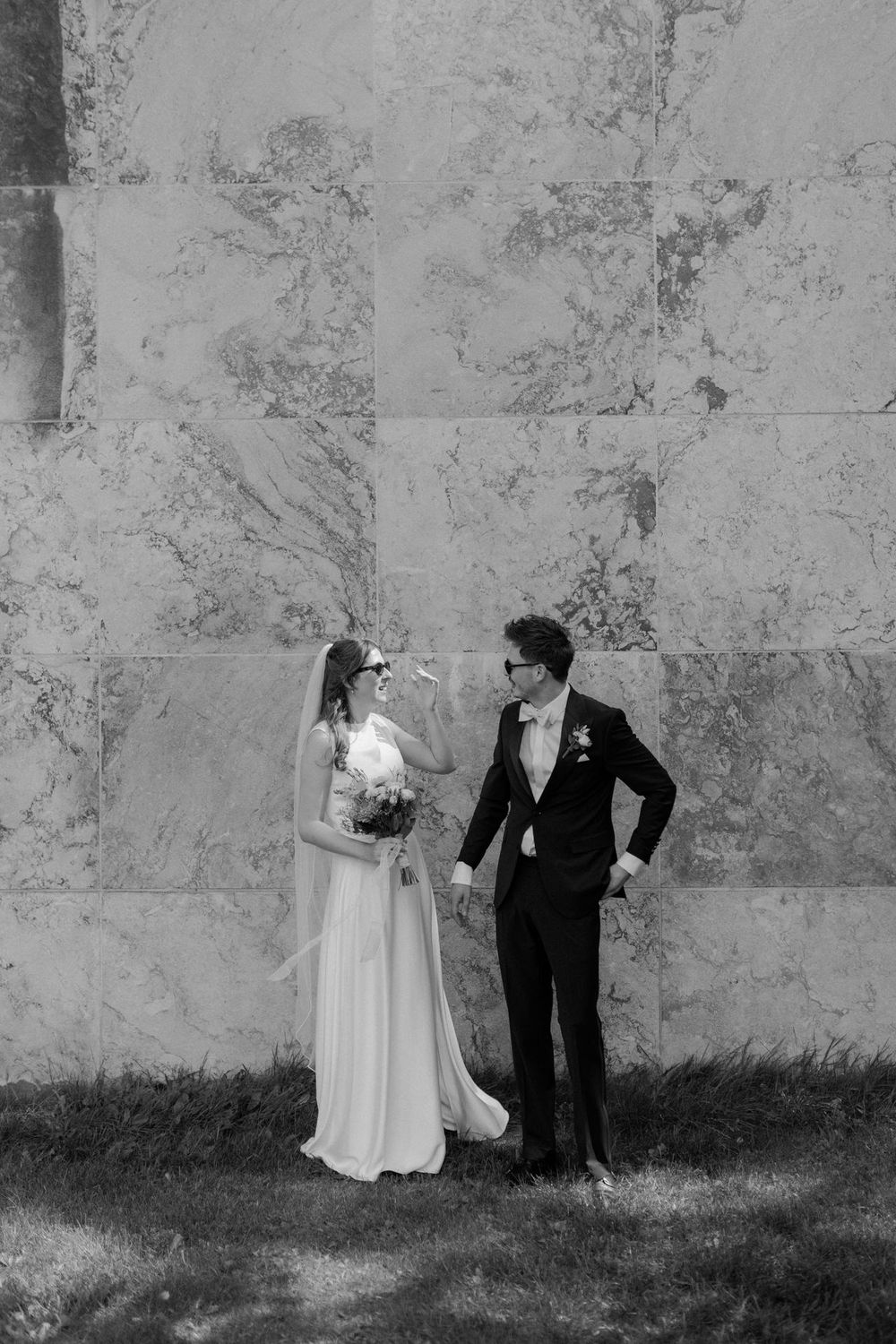 A series of black and white wedding photos showing a couple in front of Aarhus Town Hall in the heart of Aarhus city