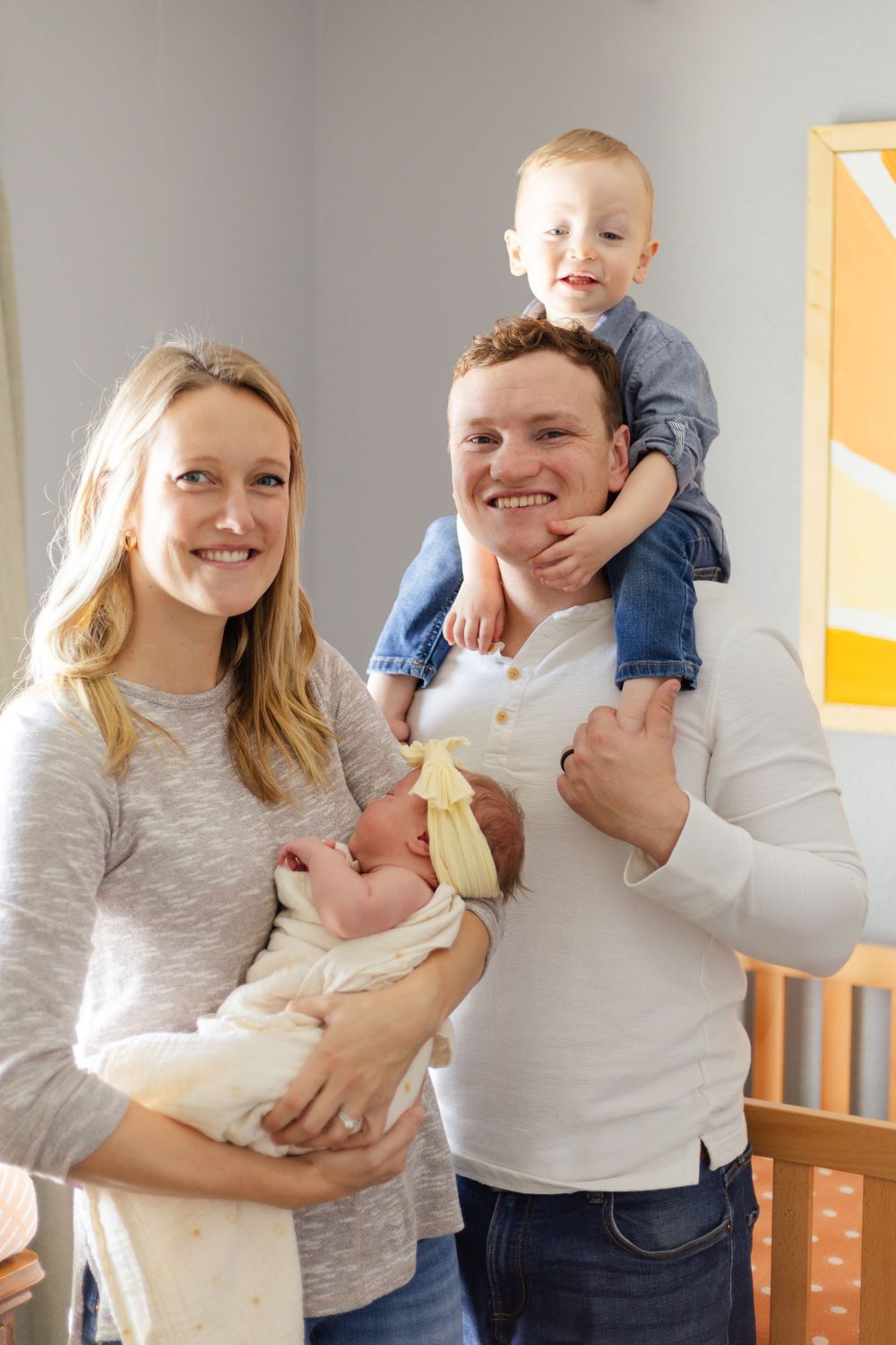 Series of tender moments with a baby in a nursery showing parents holding and bonding with their newborn.