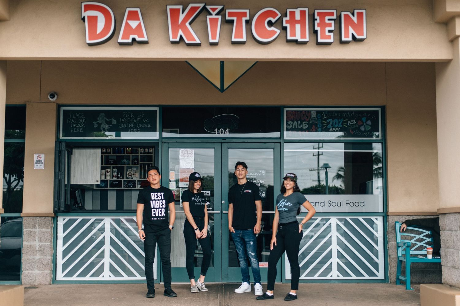 Exterior storefront view of Da Kitchen restaurant with geometric patterned doors.