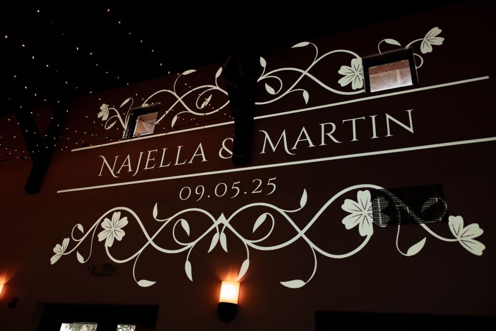 A series of decorative wedding venue signs with elegant floral designs and text displayed against dark backgrounds.