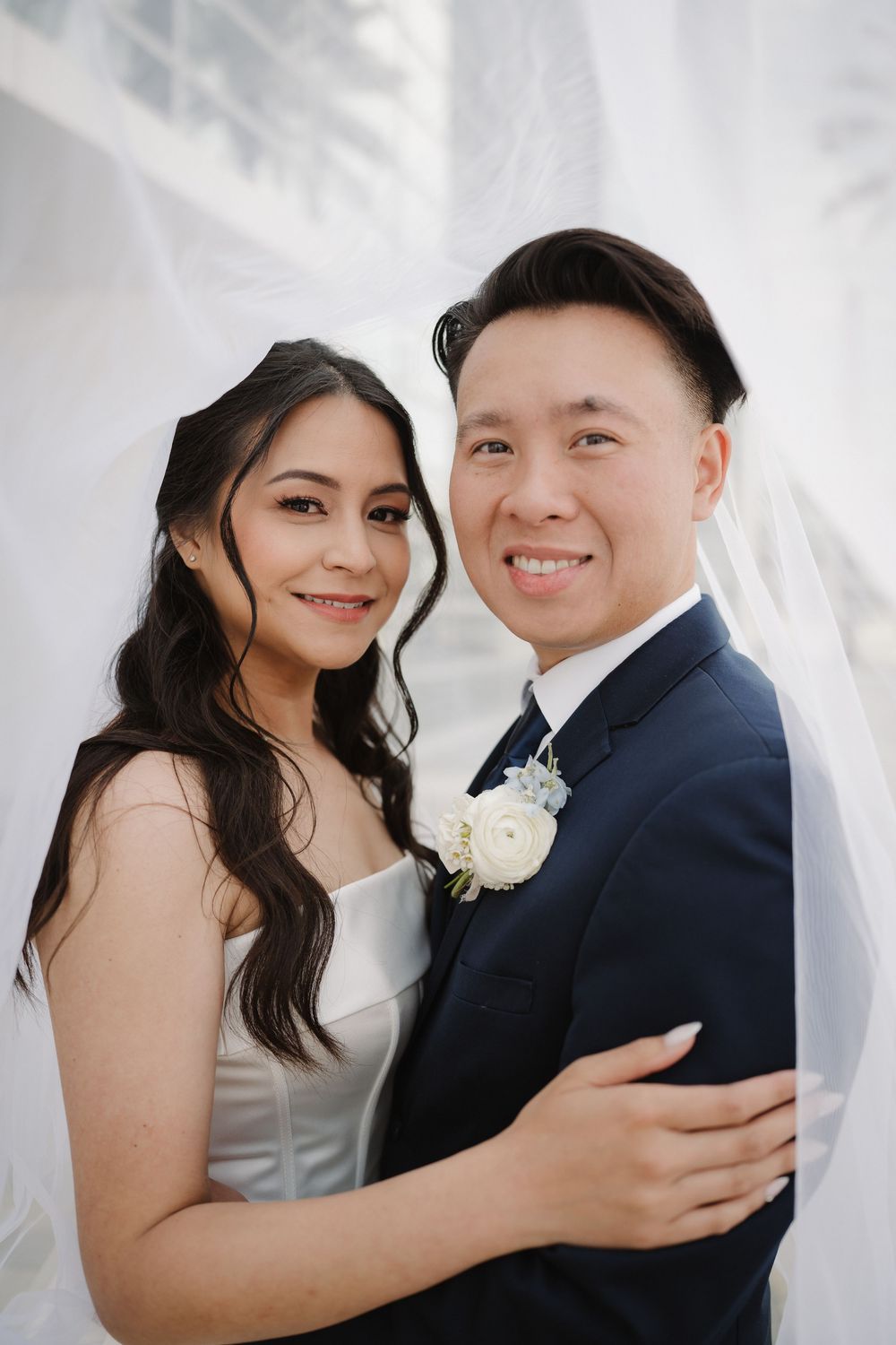 A romantic wedding photoshoot series showing a couple in traditional white dress and black suit embracing and smiling together.